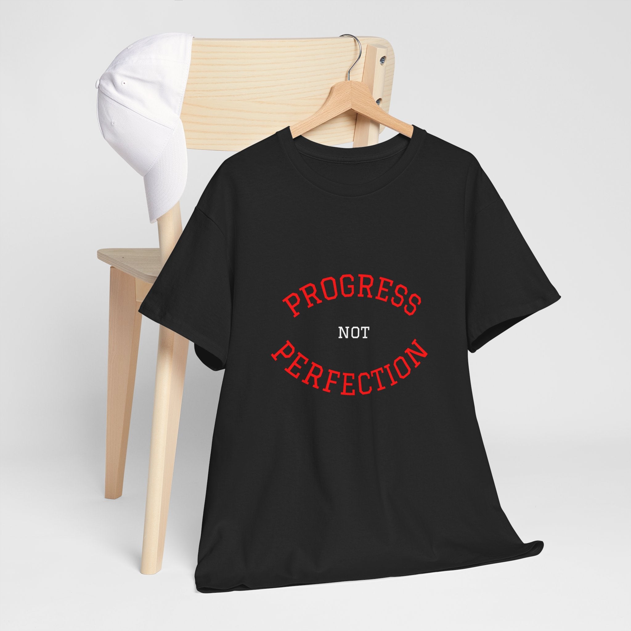Black unisex cotton T-shirt with red and white "Progress not Perfection" print