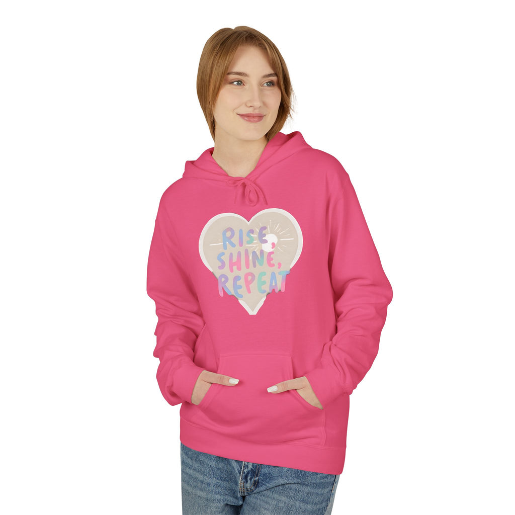 Light pink hoodie with heart graphic reading Rise Shine Repeat, front pocket, hood drawstring