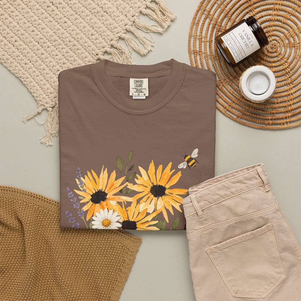Brown t-shirt with sunflower and lavender bouquet graphic and 'Bee Kind' text