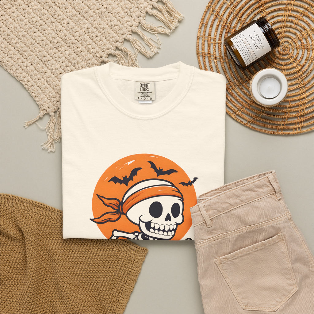 Ivory Halloween T-shirt folded flat, showing skull runner graphic on front.