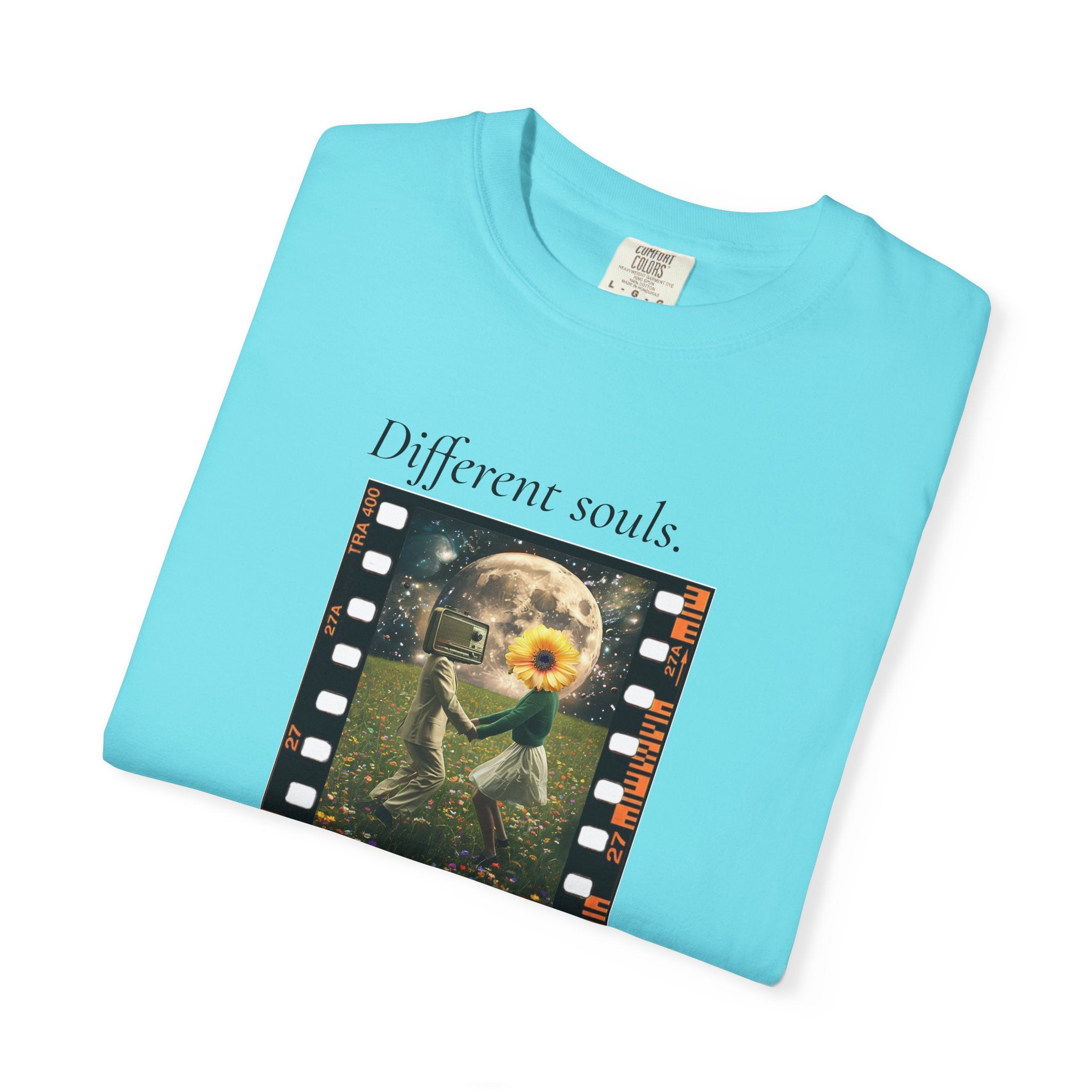 Light blue T-shirt angled view with sunflower filmstrip graphic and “Different souls” and “Same rhythm”.