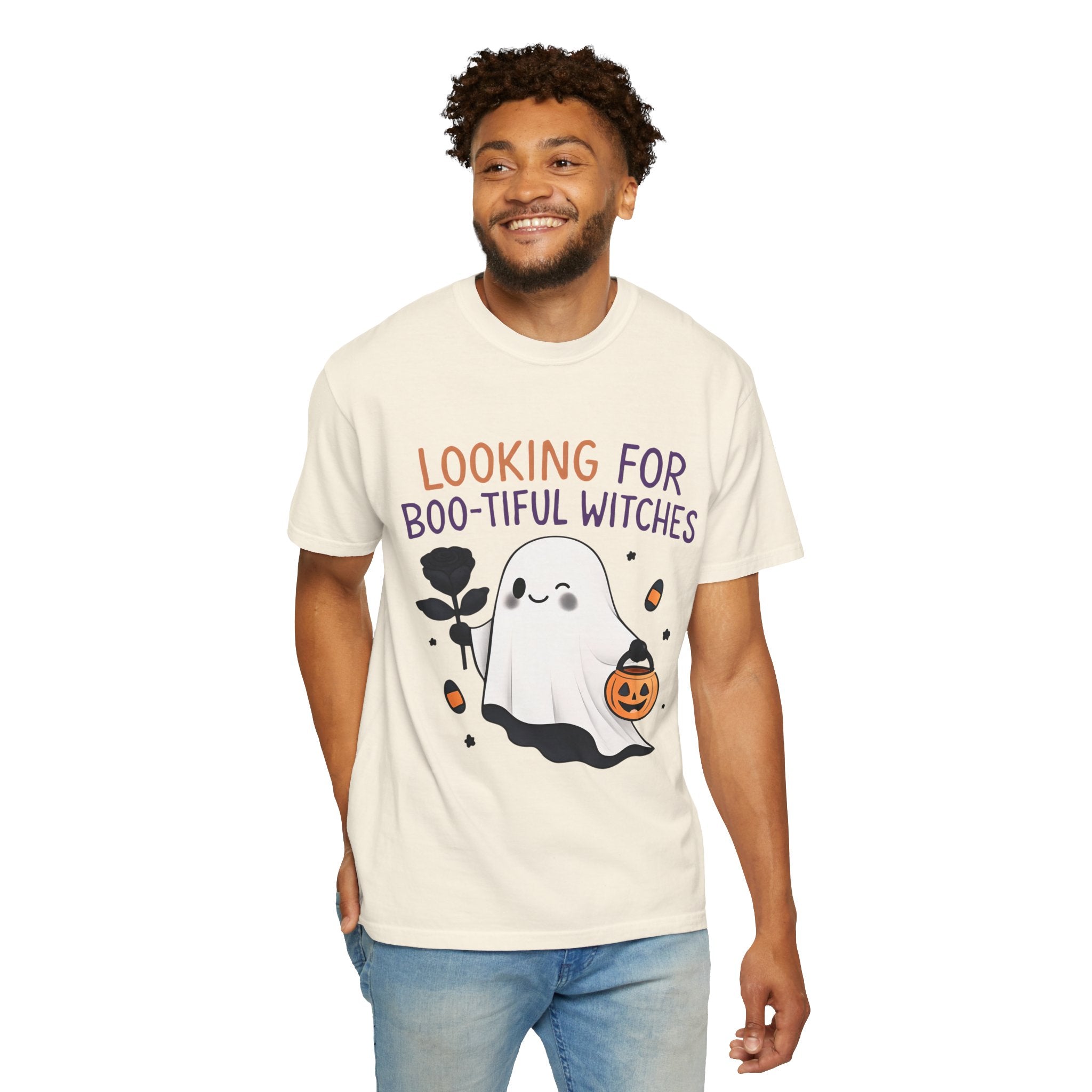Ivory unisex graphic T-shirt on model with ghost witch holding pumpkin bucket