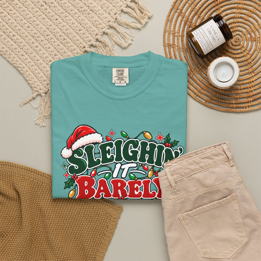 Seafoam crew-neck T-shirt with 'Sleighin' It Barely' holiday graphic