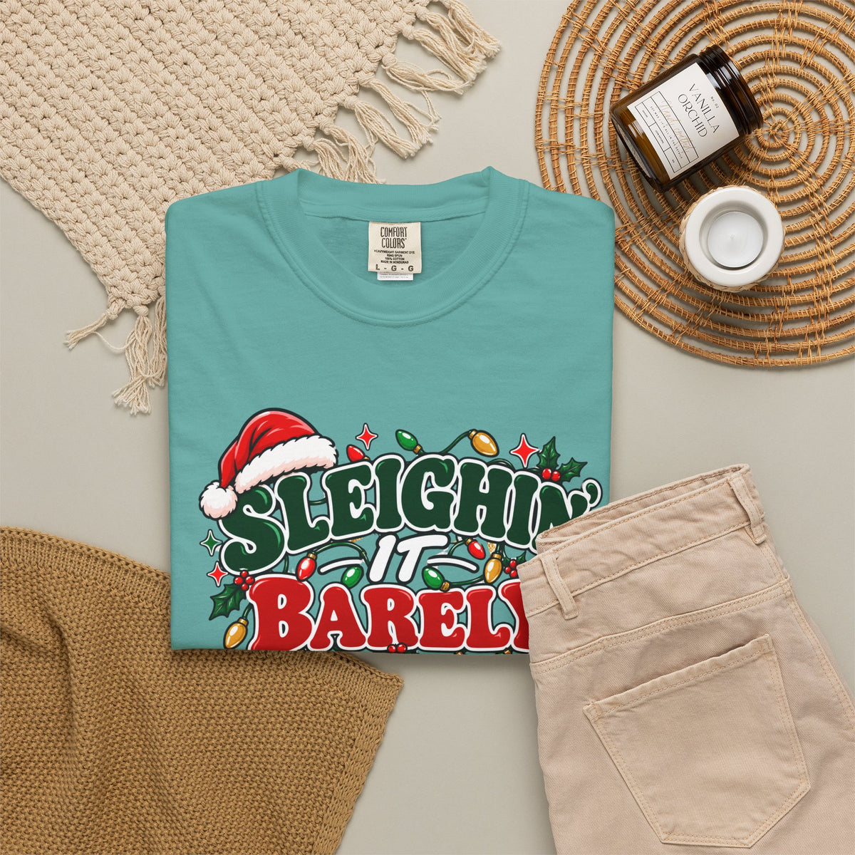 Seafoam crew-neck T-shirt with 'Sleighin' It Barely' holiday graphic