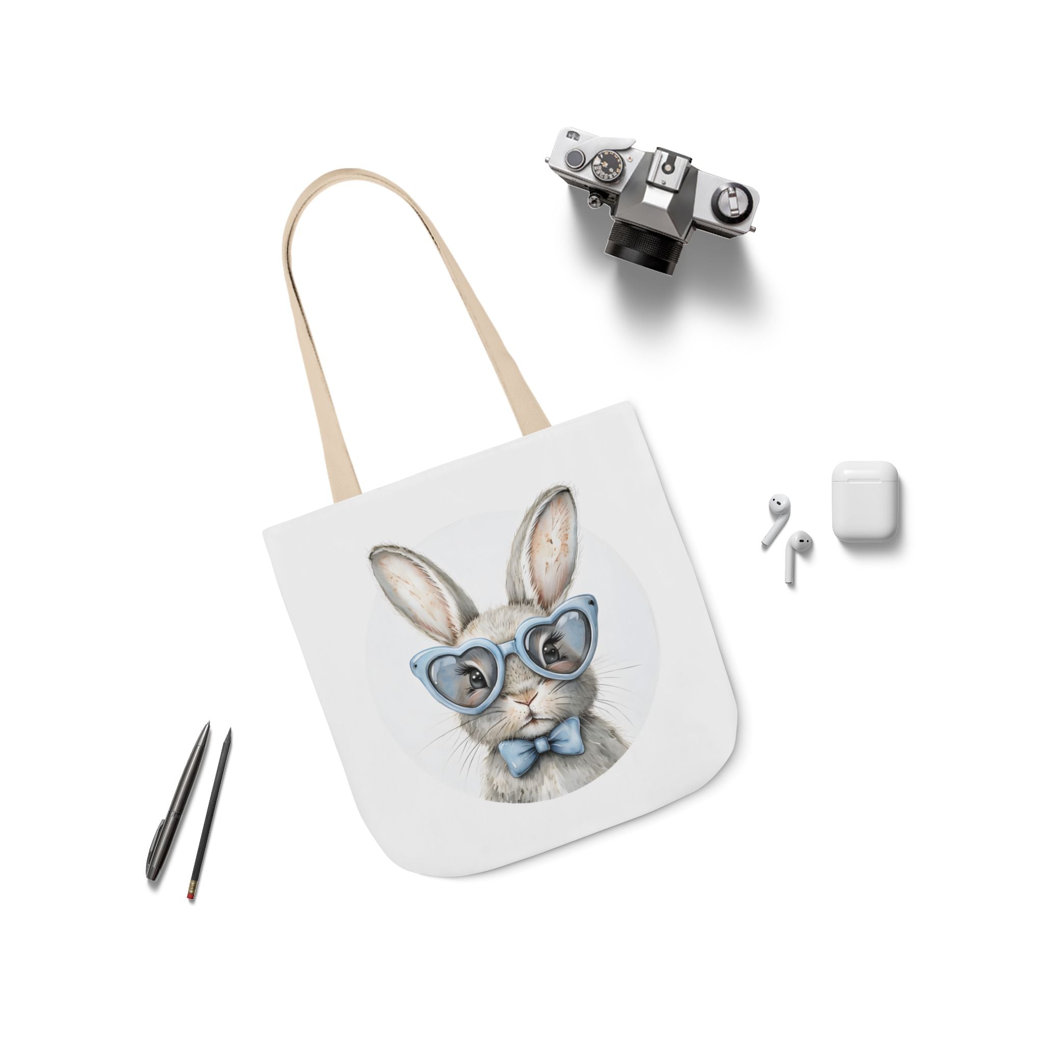 Bunny canvas tote bag with rabbit face graphic, beige straps laid flat