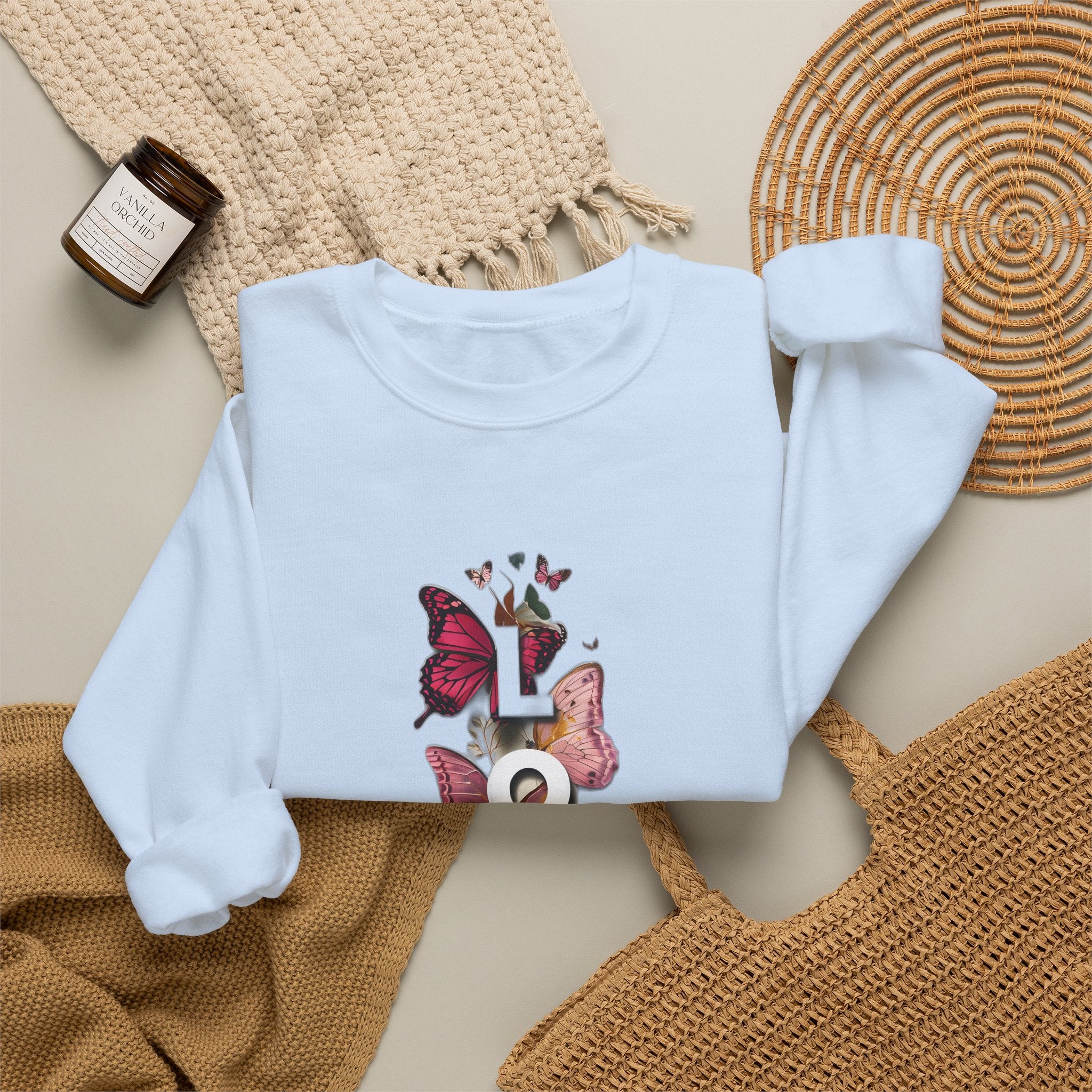 Light blue crewneck sweatshirt with butterfly LOVE graphic, long sleeves