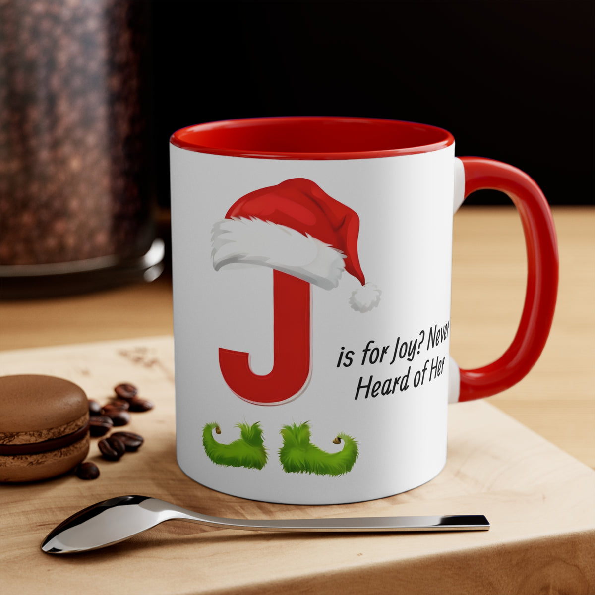 White mug with red J, Santa hat, green mustache graphic; red handle