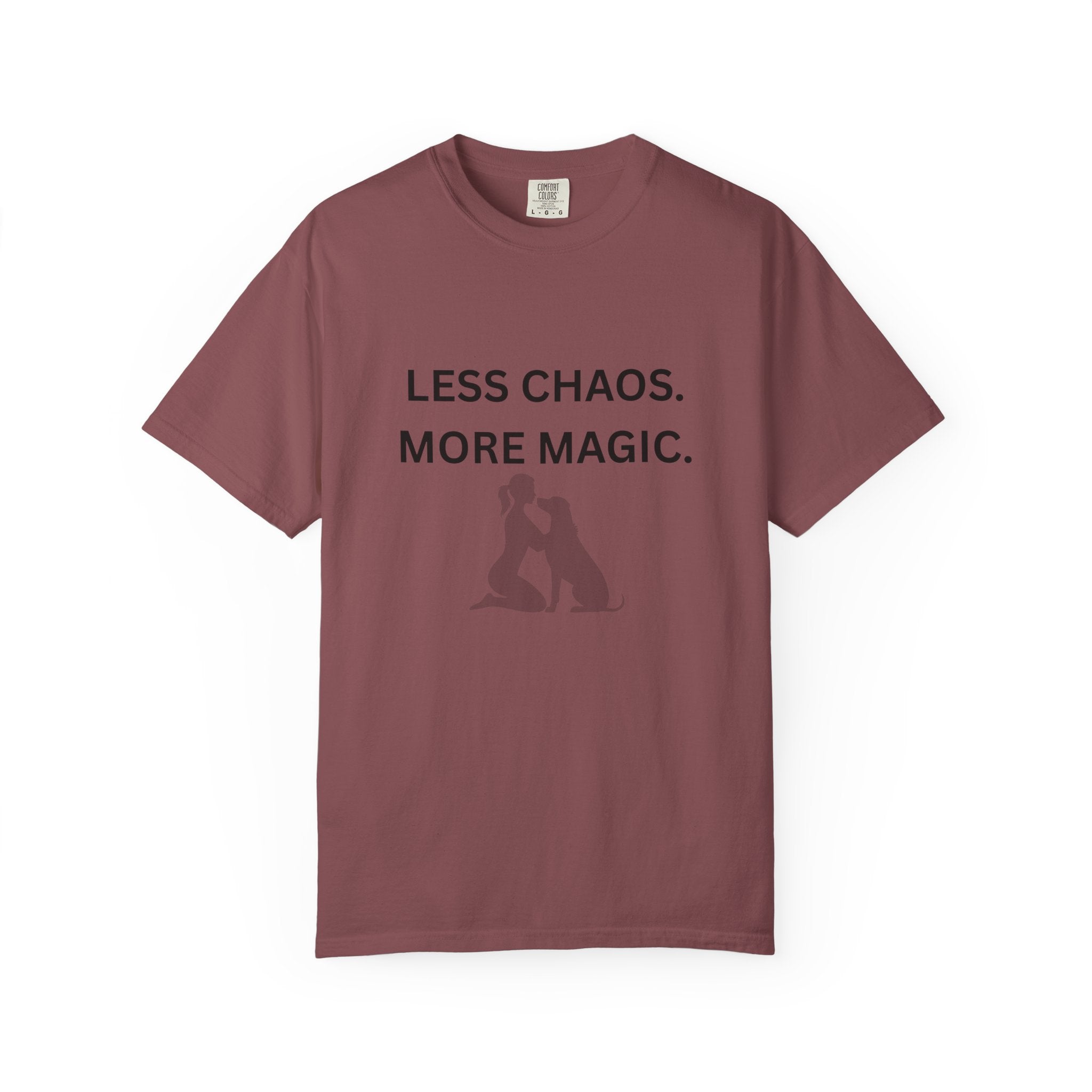 Burgundy crew-neck T-shirt with 'LESS CHAOS. MORE MAGIC.' text and woman-dog silhouette