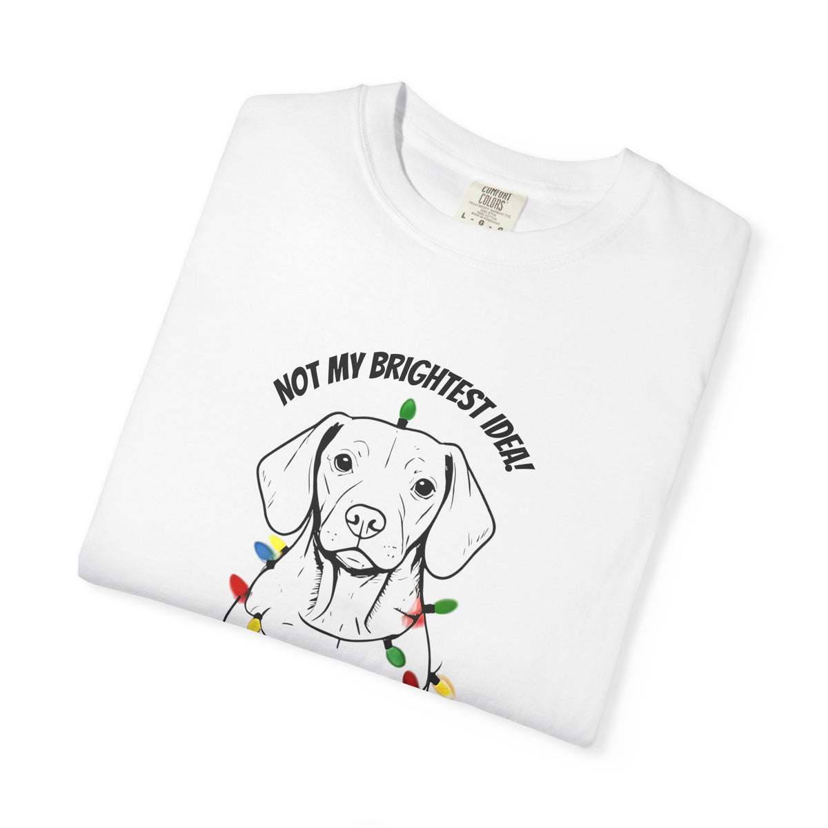 White puppy T-shirt close-up: dog face with holiday lights and arched text