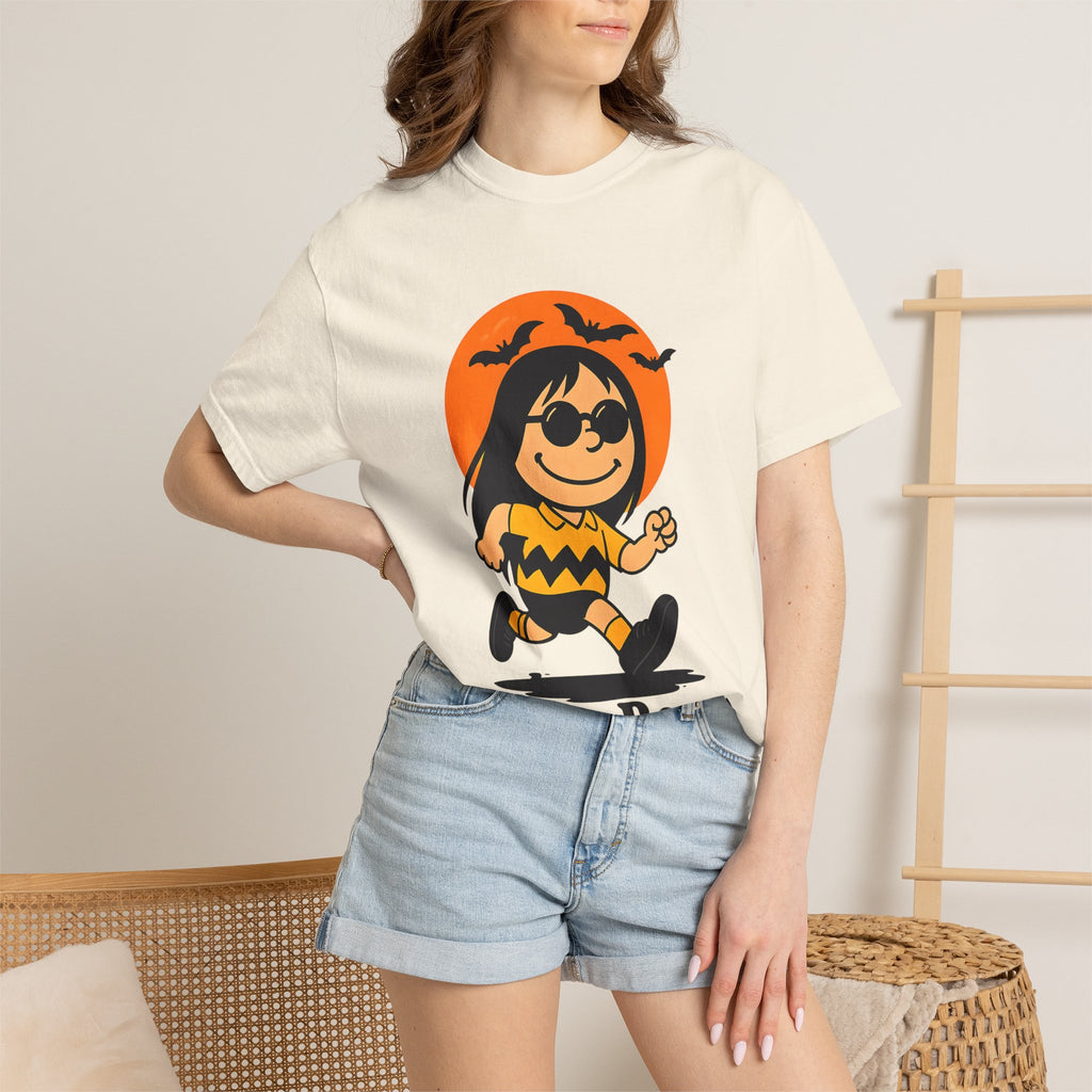 Ivory unisex T-shirt worn by model with orange Halloween witch front print