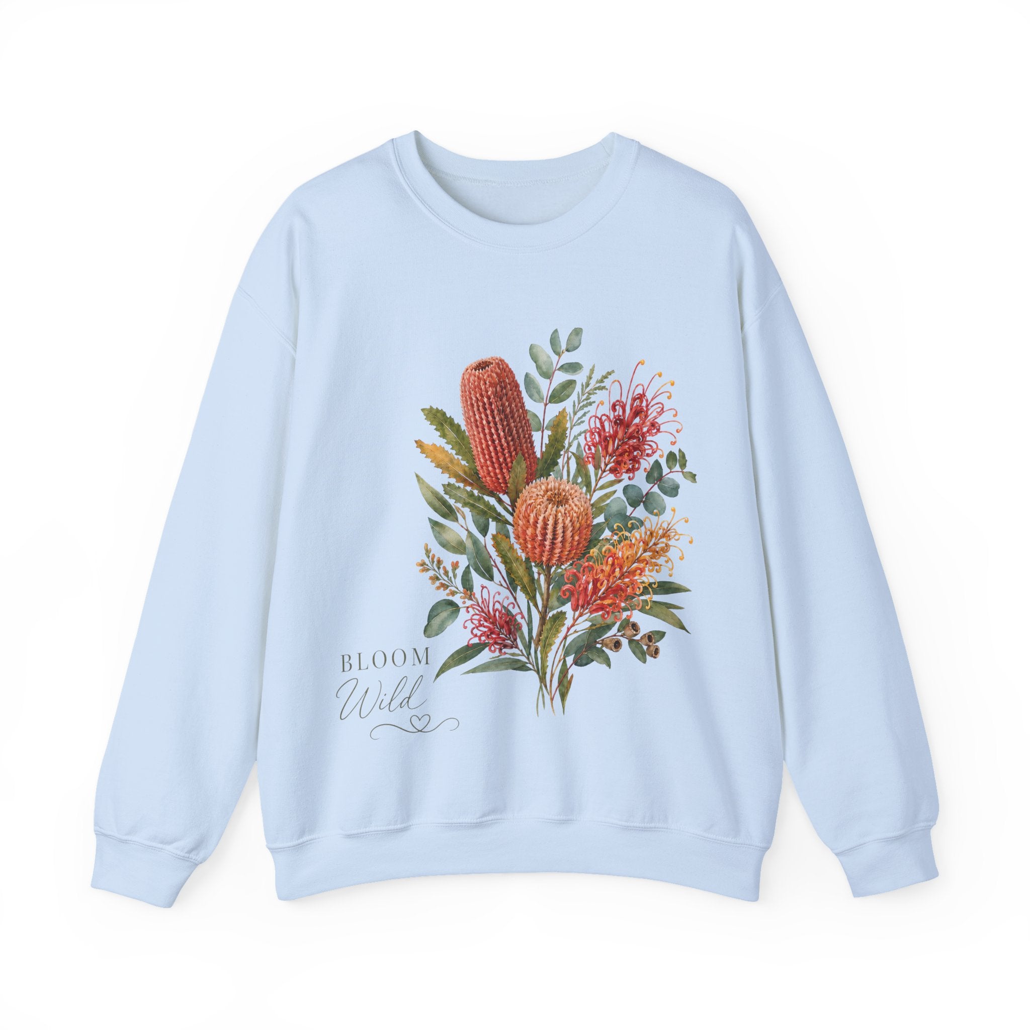 Light blue crewneck sweatshirt with wildflower bouquet and 'Bloom Wild' text, long sleeves