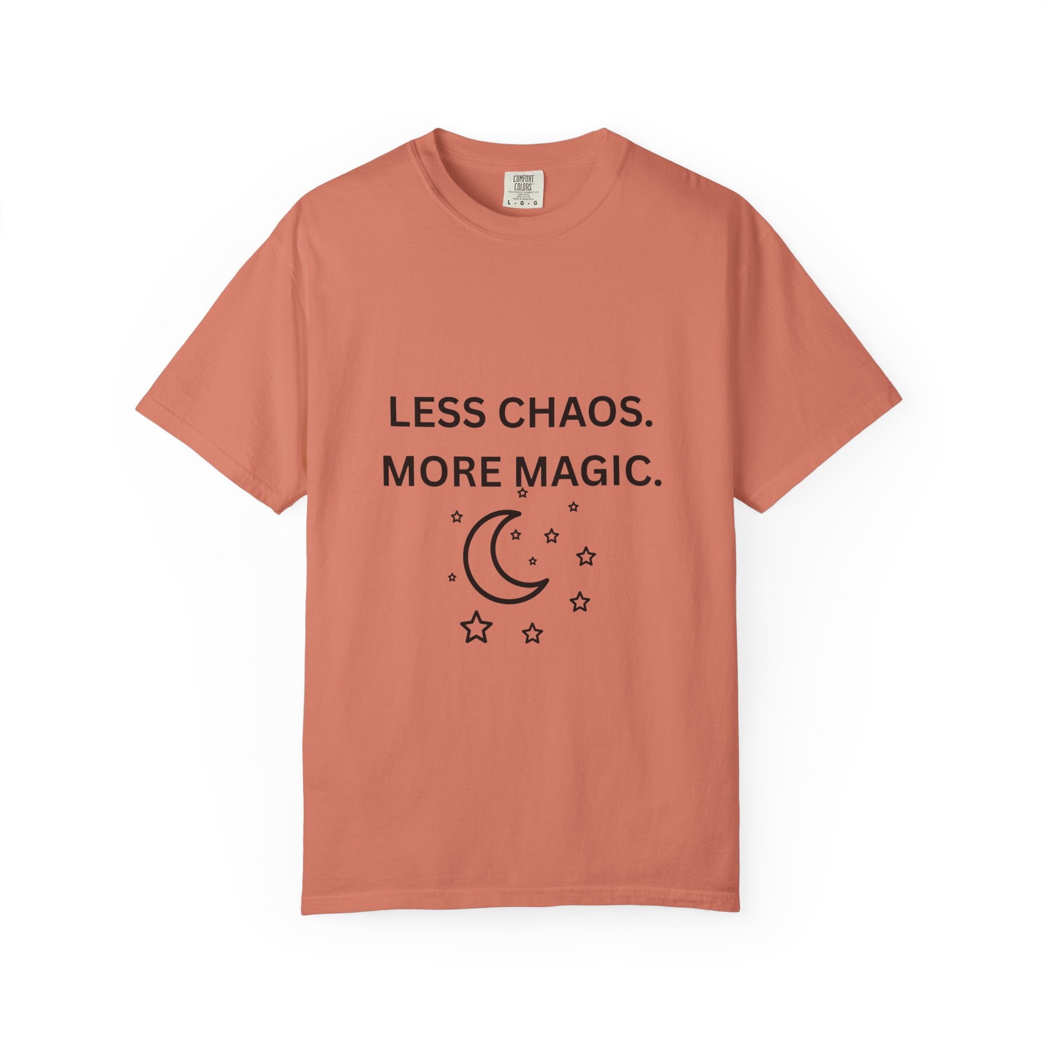 Coral graphic t-shirt with 'LESS CHAOS. MORE MAGIC.' and crescent moon stars print
