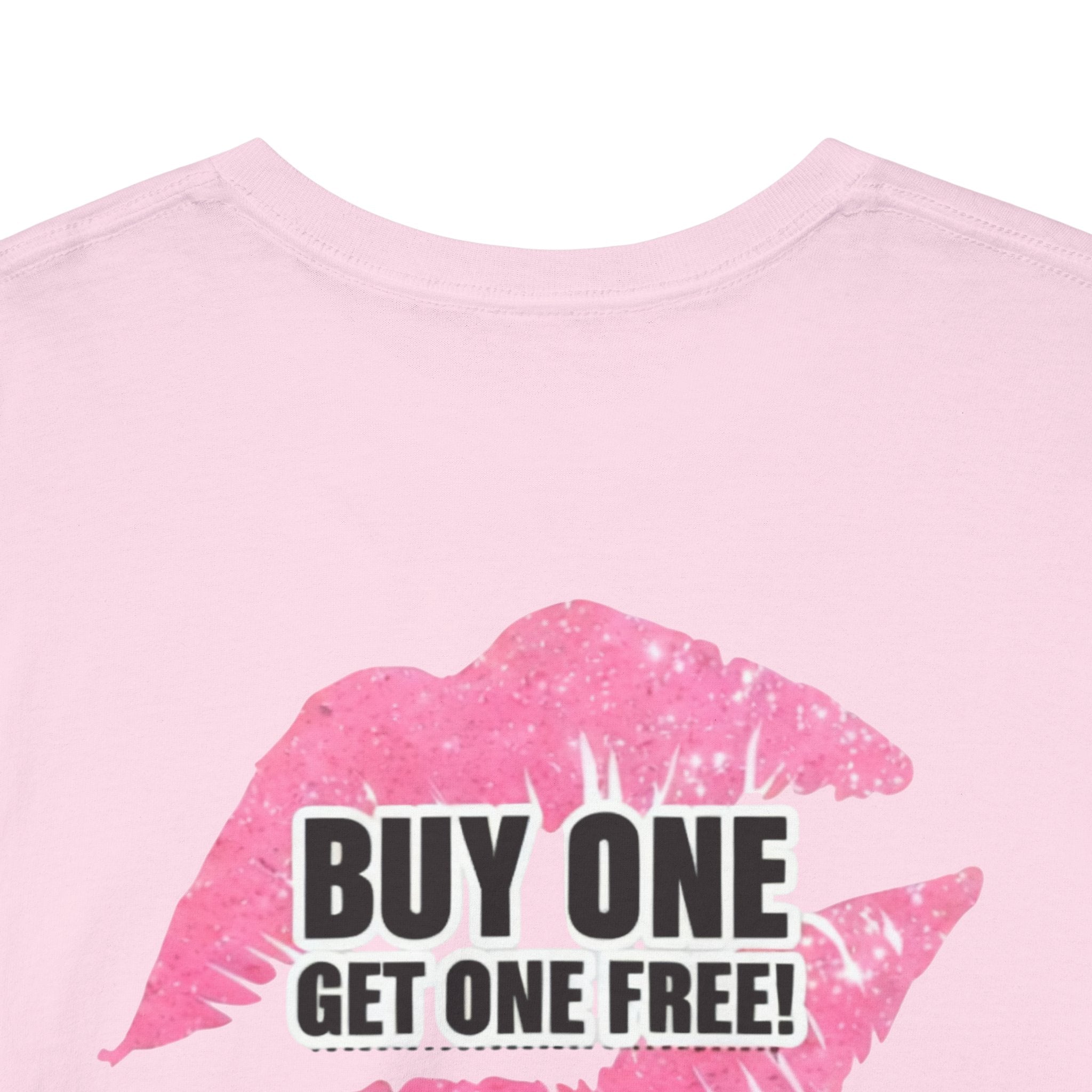 Close-up of light pink t-shirt back print: “BUY ONE GET ONE FREE!” with “Smile”