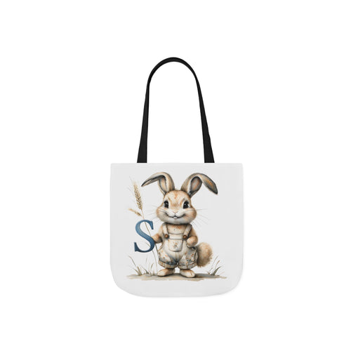 Tote bag with bunny graphic and blue letter S on front, black handles
