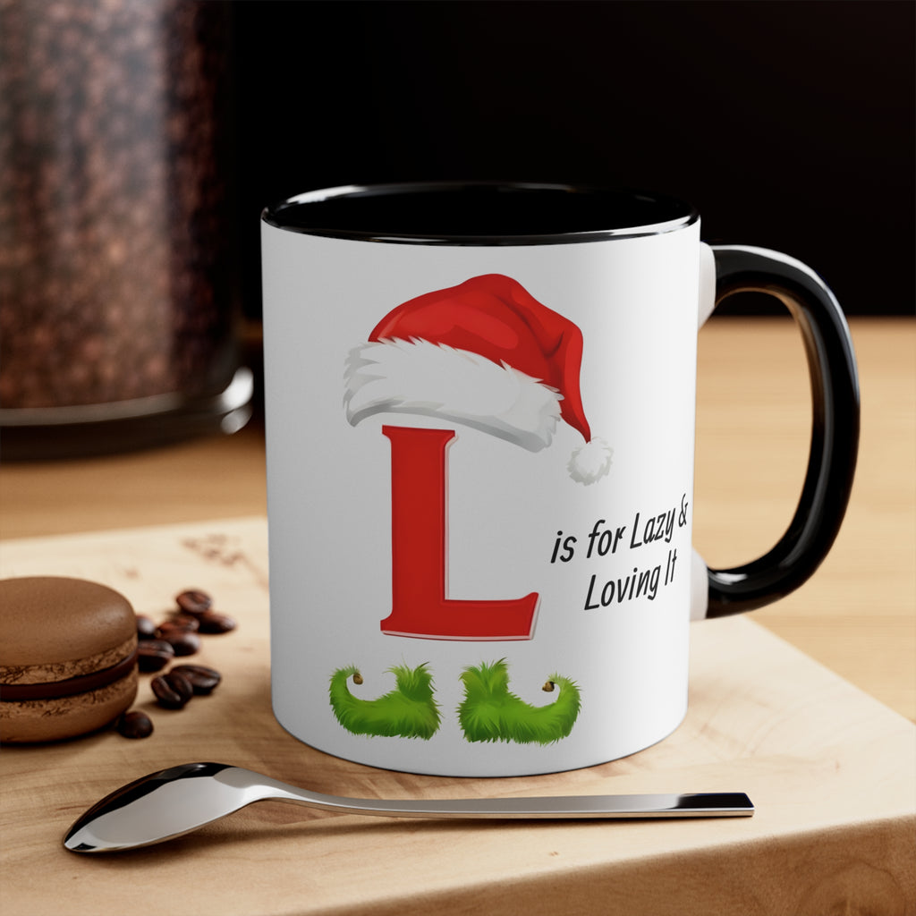 Black-handled coffee mug with letter L, Santa hat, and “is for Lazy & Loving It”