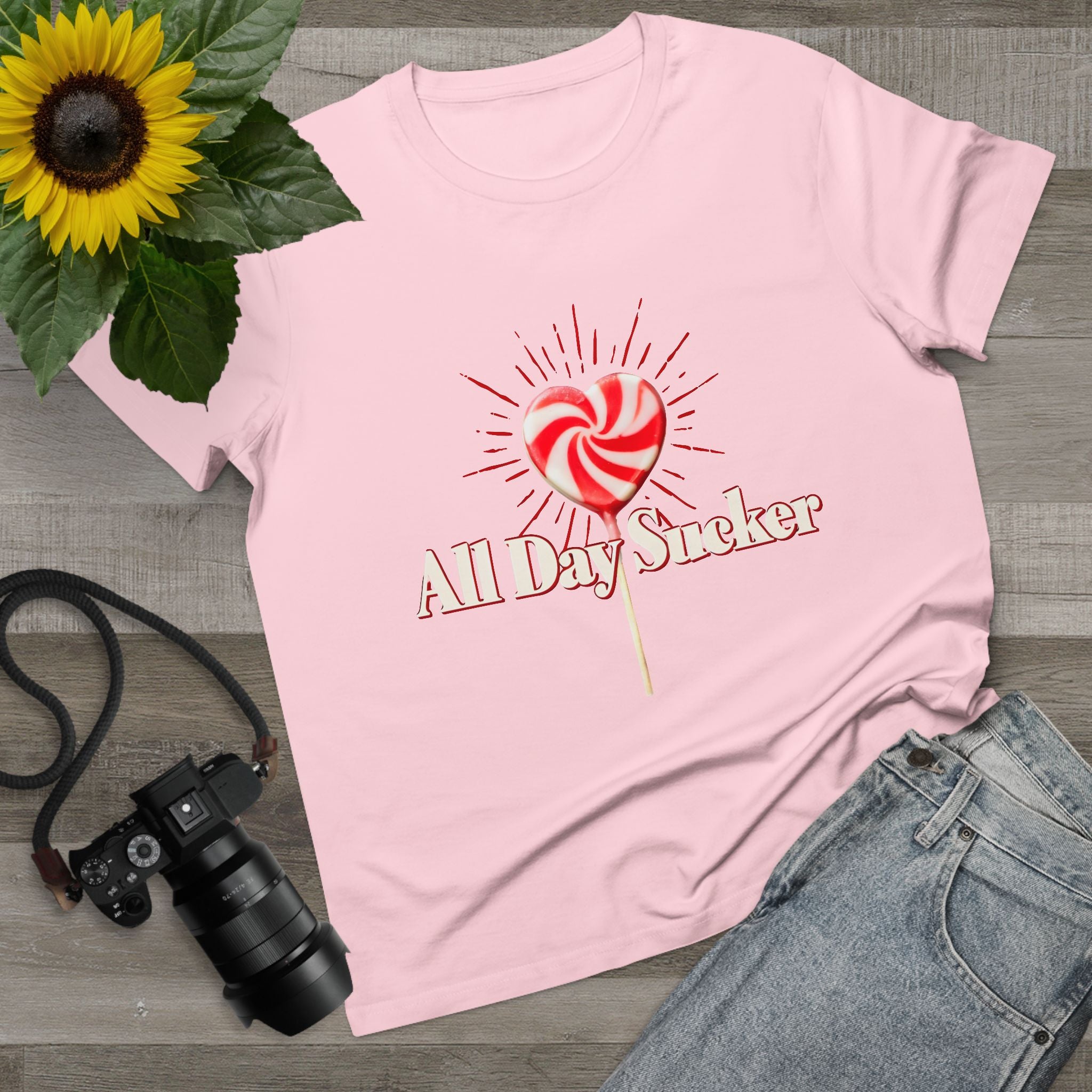 Pink women's graphic T-shirt with lollipop heart and 'All Day Sucker' text