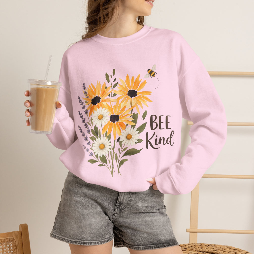 Light pink crewneck sweatshirt with sunflower bouquet graphic and text "Bee Kind"
