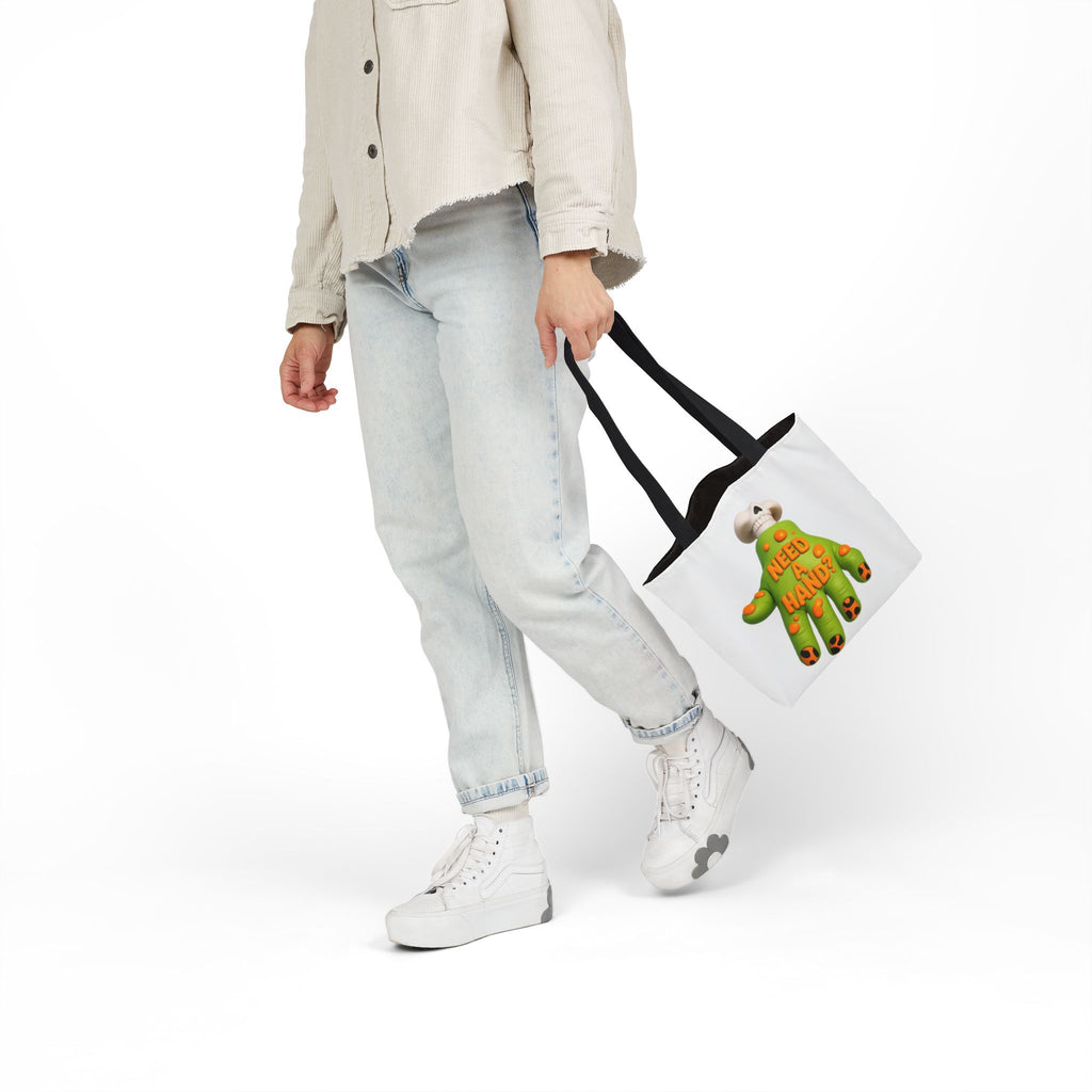 White canvas tote bag with black handles and "Need A Hand" hand-themed artwork.