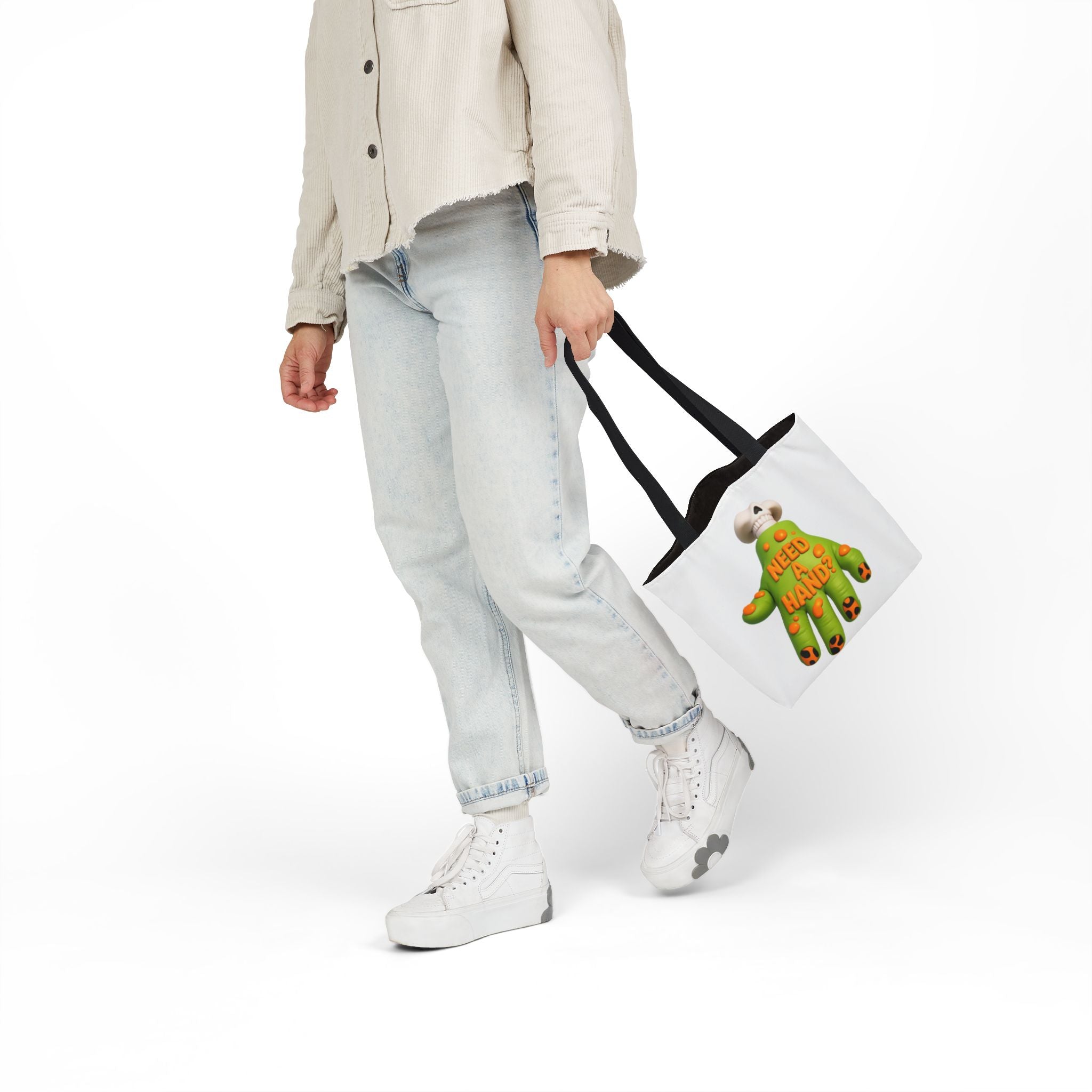 White canvas tote bag with black handles and "Need A Hand" hand-themed artwork.