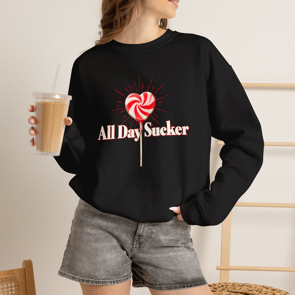 Black crewneck sweatshirt with red-and-white lollipop heart graphic and text
