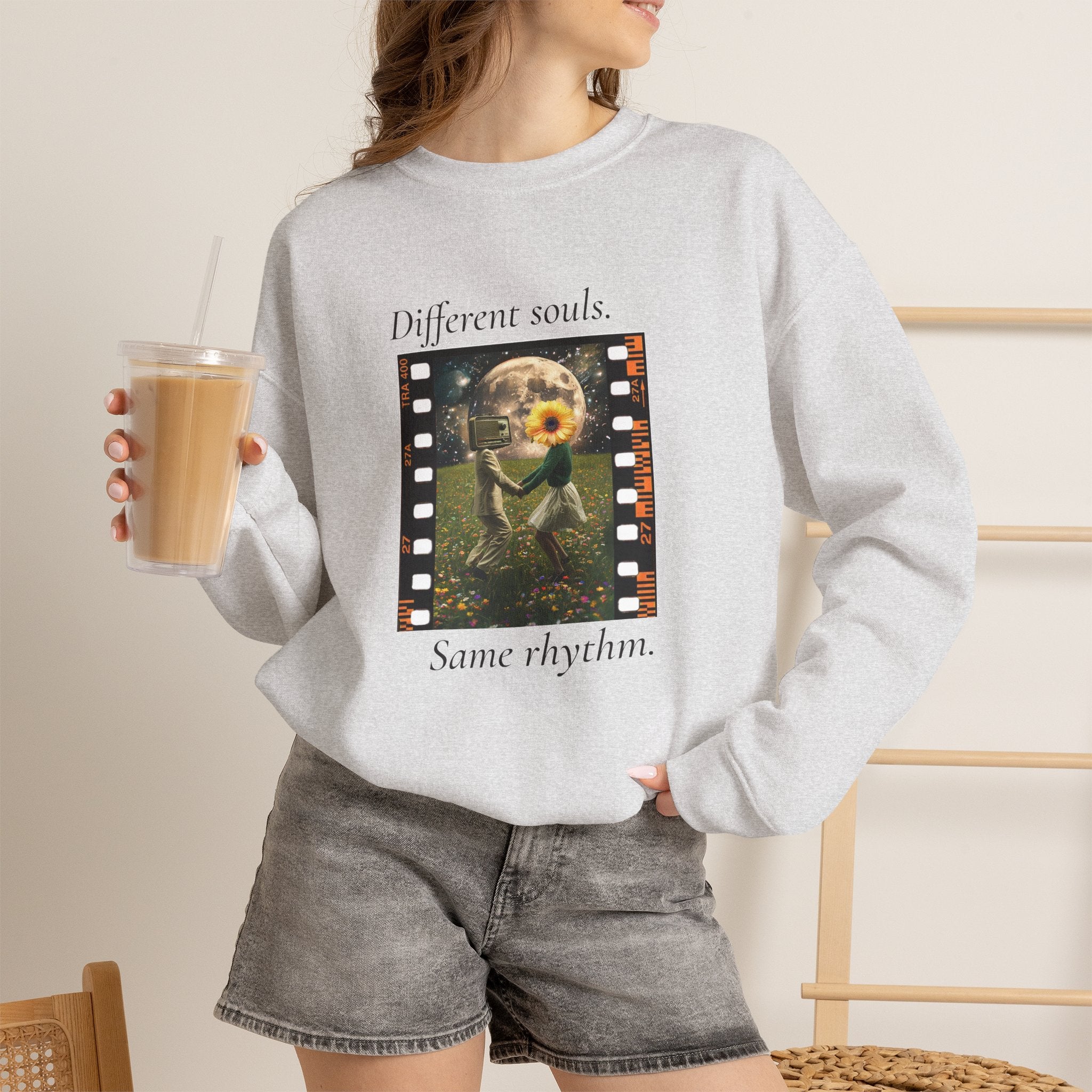 Light gray crewneck sweatshirt with “Different souls.” and “Same rhythm.” graphic