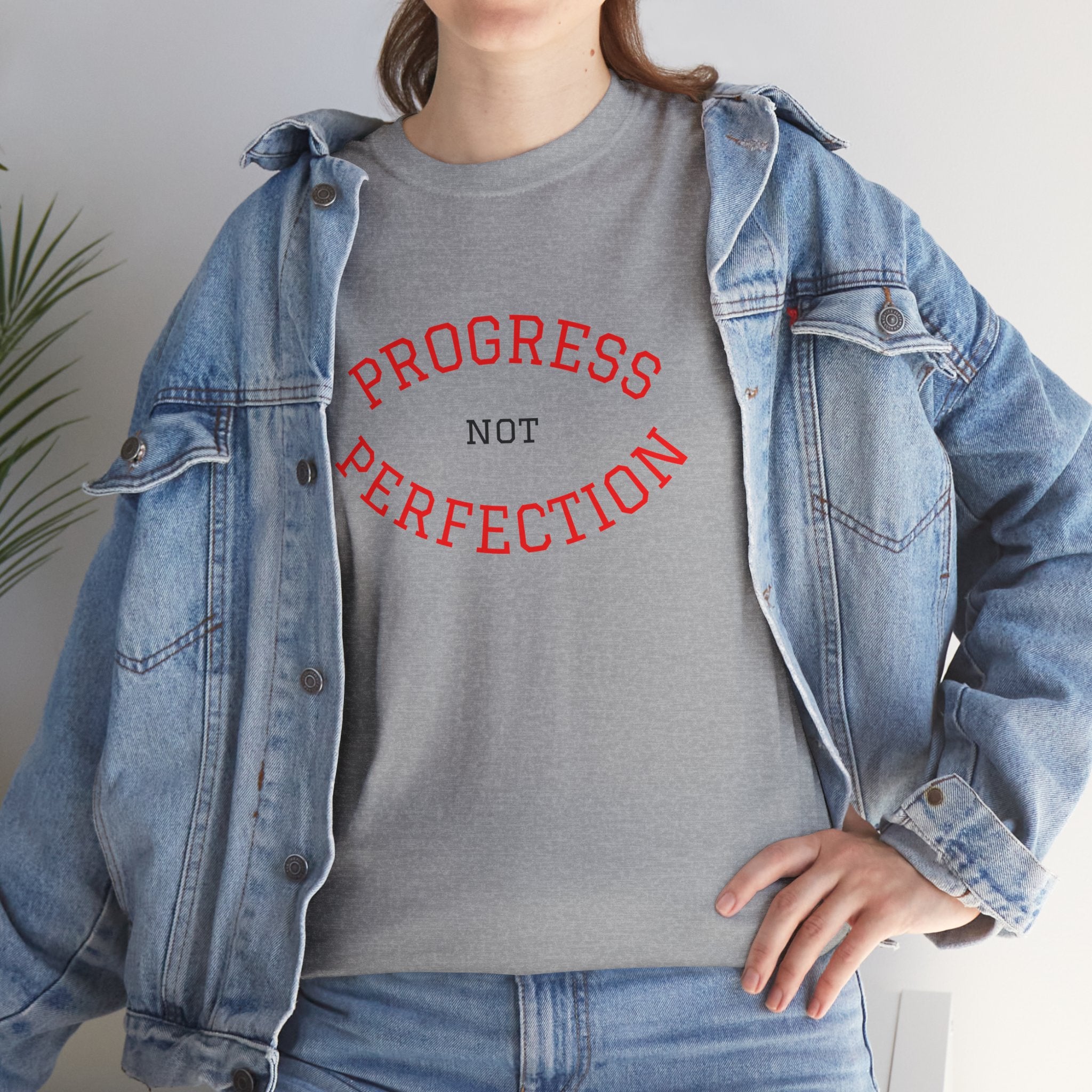 Unisex sport grey cotton T-shirt on model with "Progress not Perfection" print