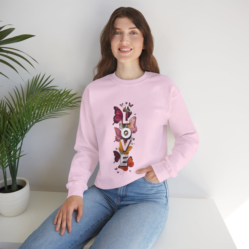 Light pink sweatshirt with long sleeves and LOVE word butterfly graphic on front