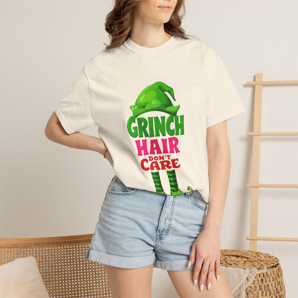 White crew-neck graphic t-shirt with green, pink, and red Grinch hair care print