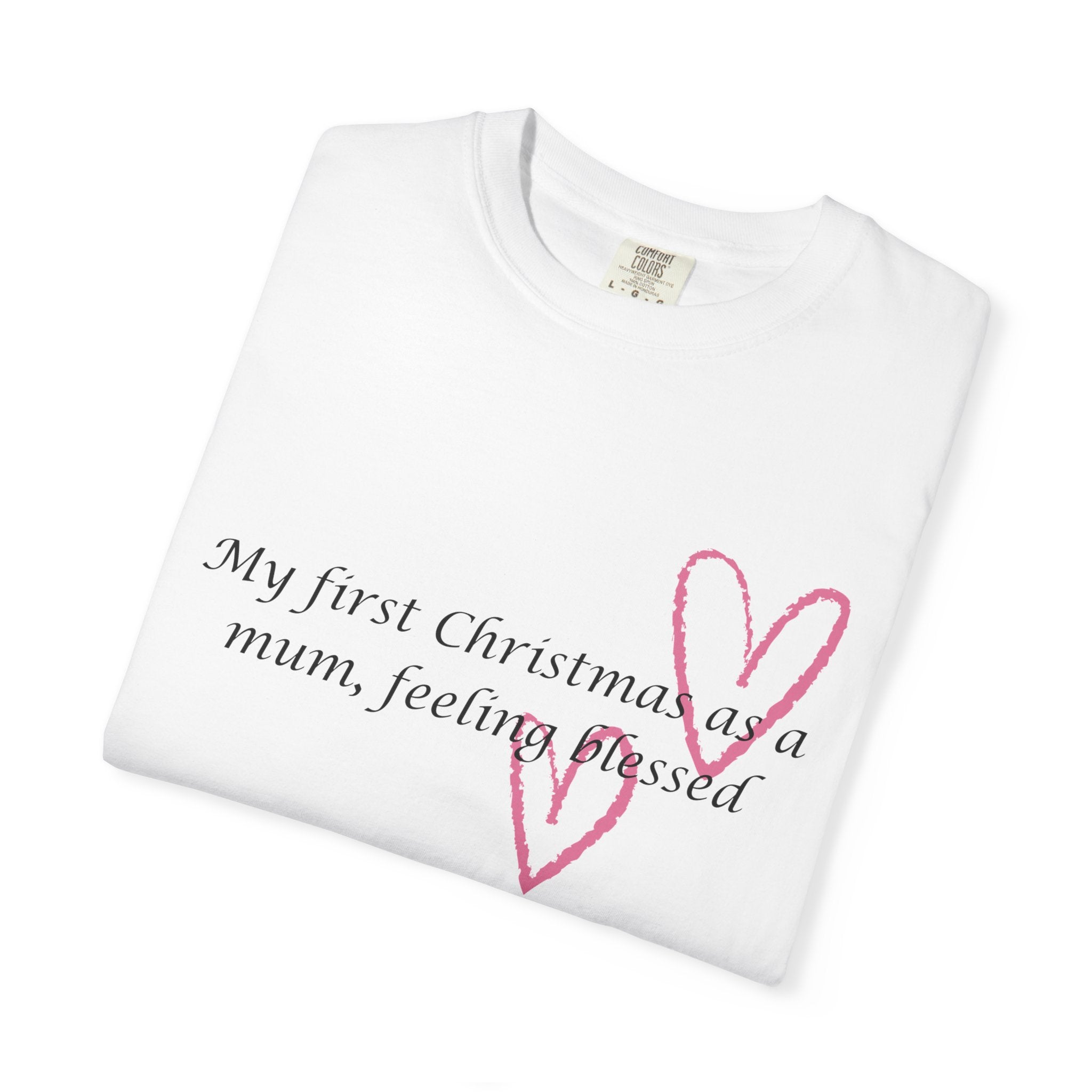 Folded white Christmas mum t-shirt with pink heart outline and “feeling blessed” text