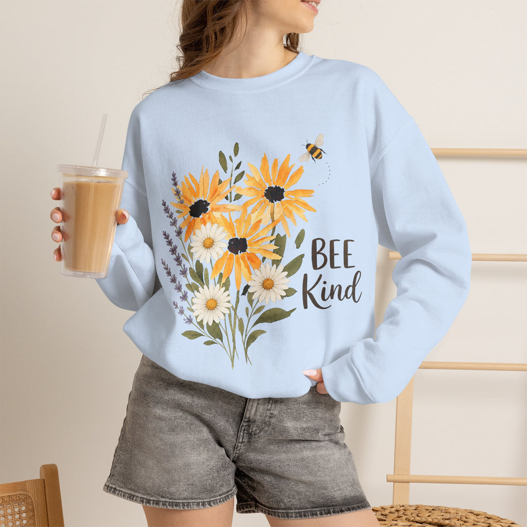 Light blue crewneck sweatshirt with sunflower bouquet graphic and text "Bee Kind"