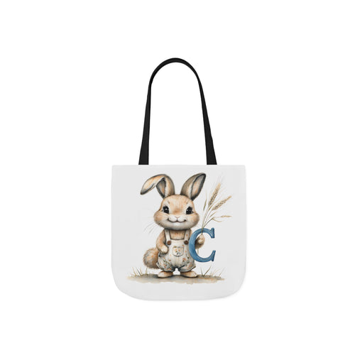 Black canvas tote bag with bunny and letter C graphic, fabric handles