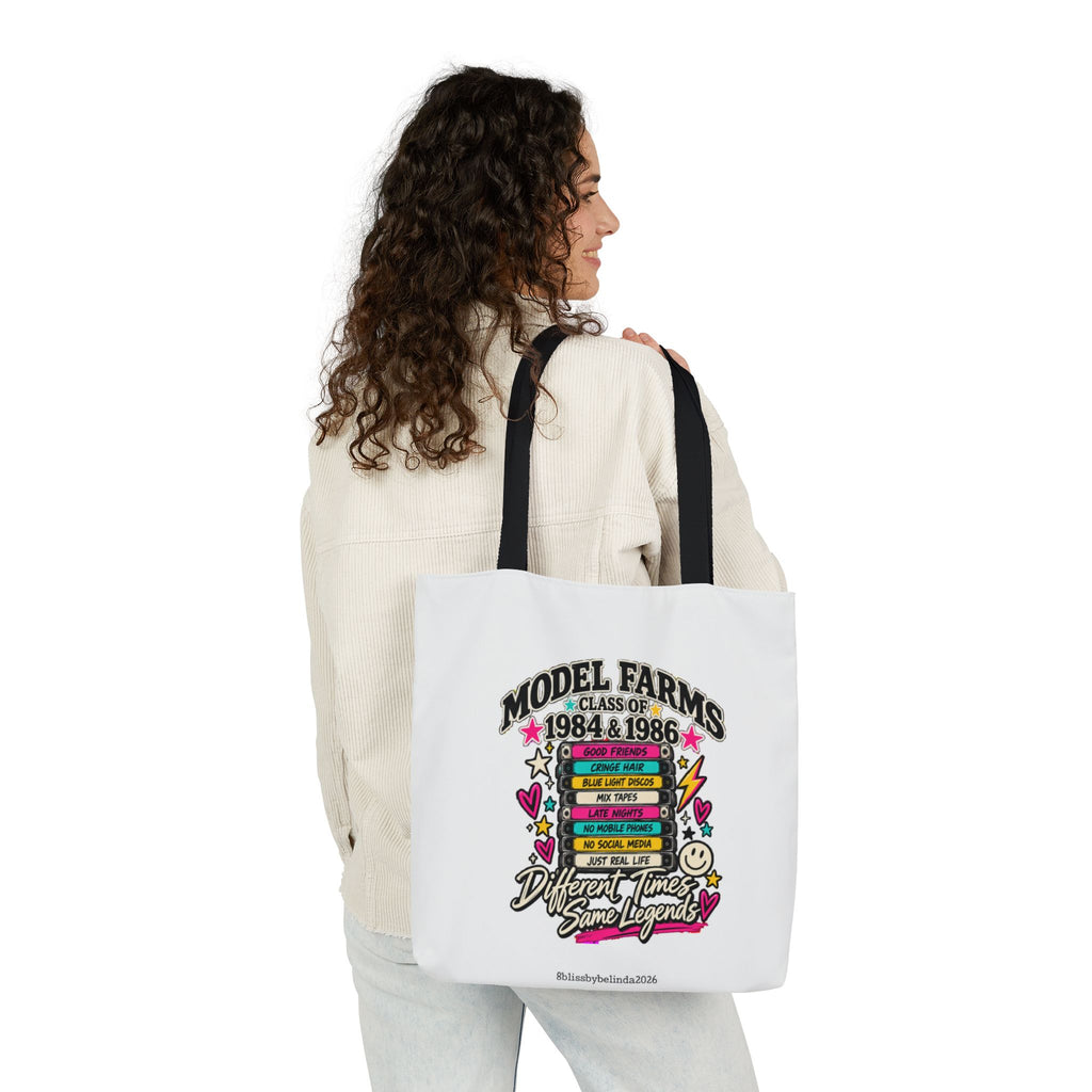 White canvas retro tote bag with black straps and colorful graduation graphic front