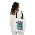 White canvas retro tote bag with black straps and colorful graduation graphic front