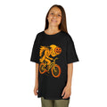 Kids black T-shirt with orange pumpkin-head rider graphic on a bicycle