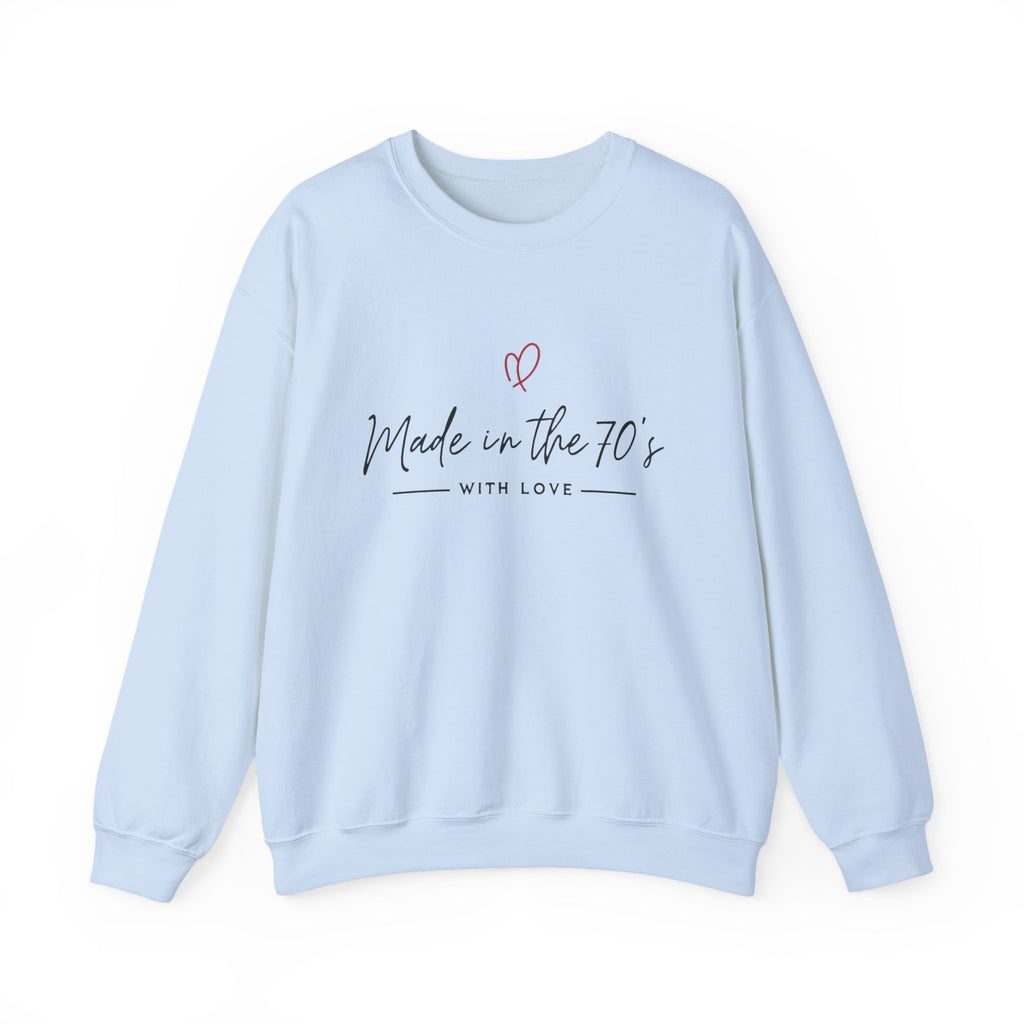Unisex crewneck sweatshirt, light blue, front view with “Made in the 70’s” heart graphic