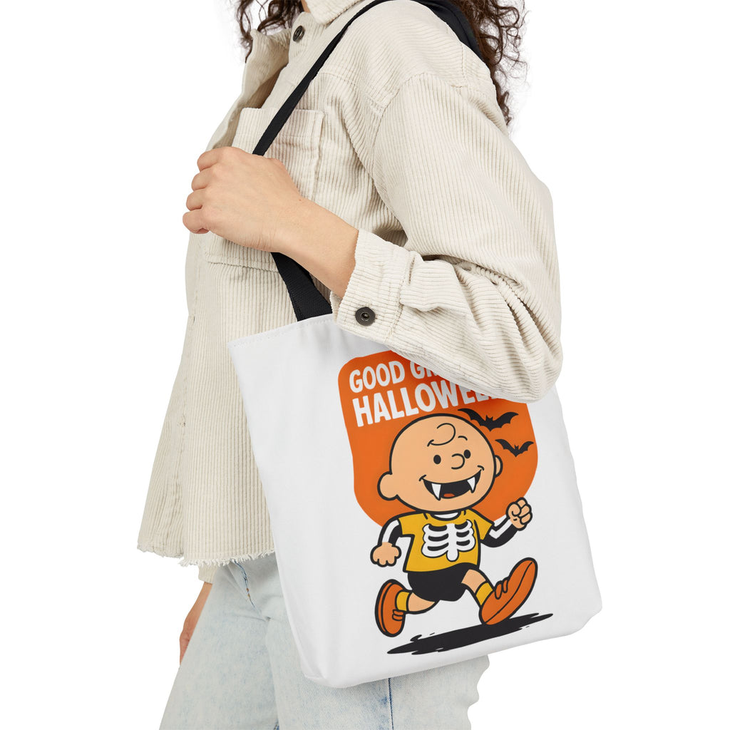 White canvas tote with black handles, cartoon “Good Grief, It’s Halloween!” graphic.
