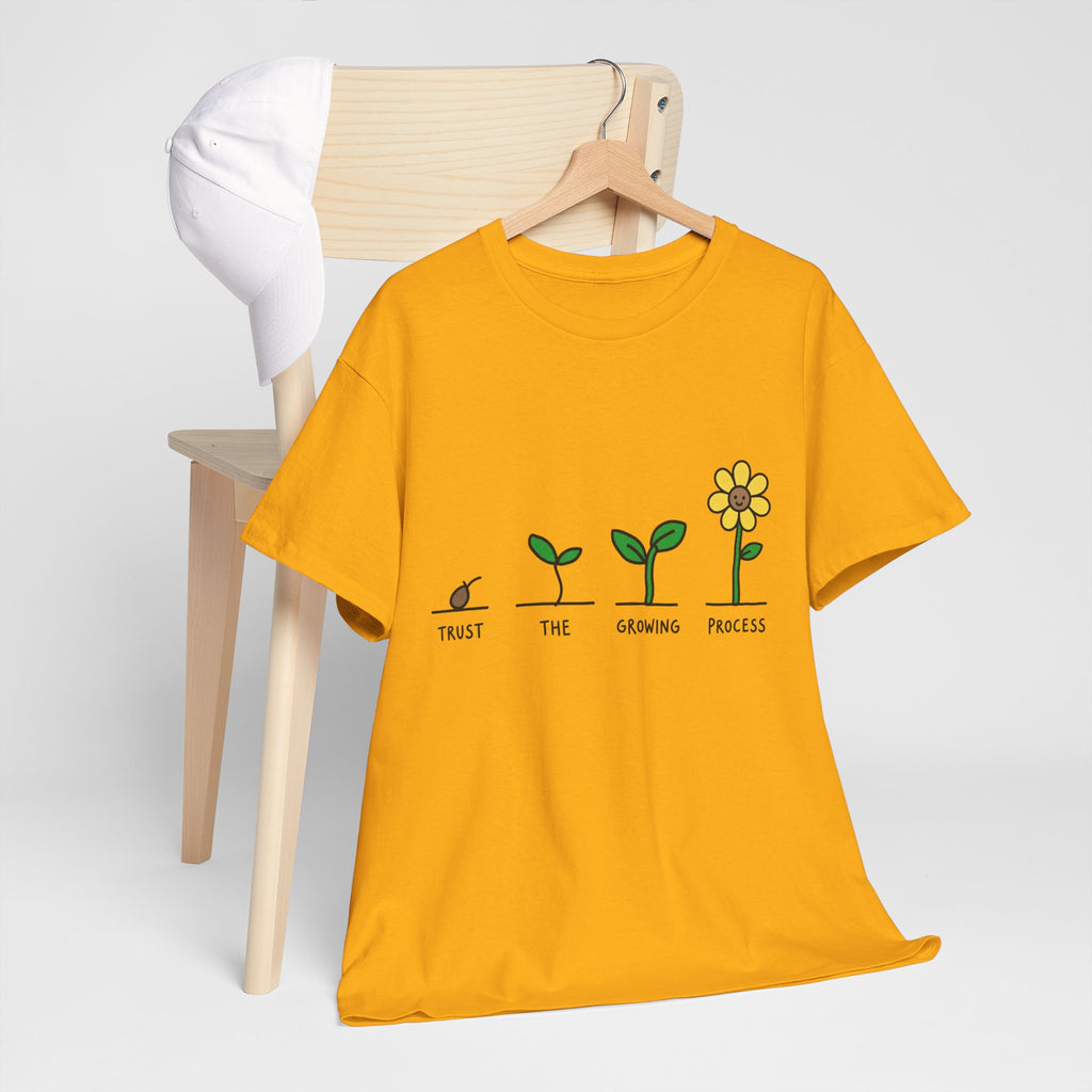 Gold crew-neck T-shirt with seedling-to-flower graphic on hanger