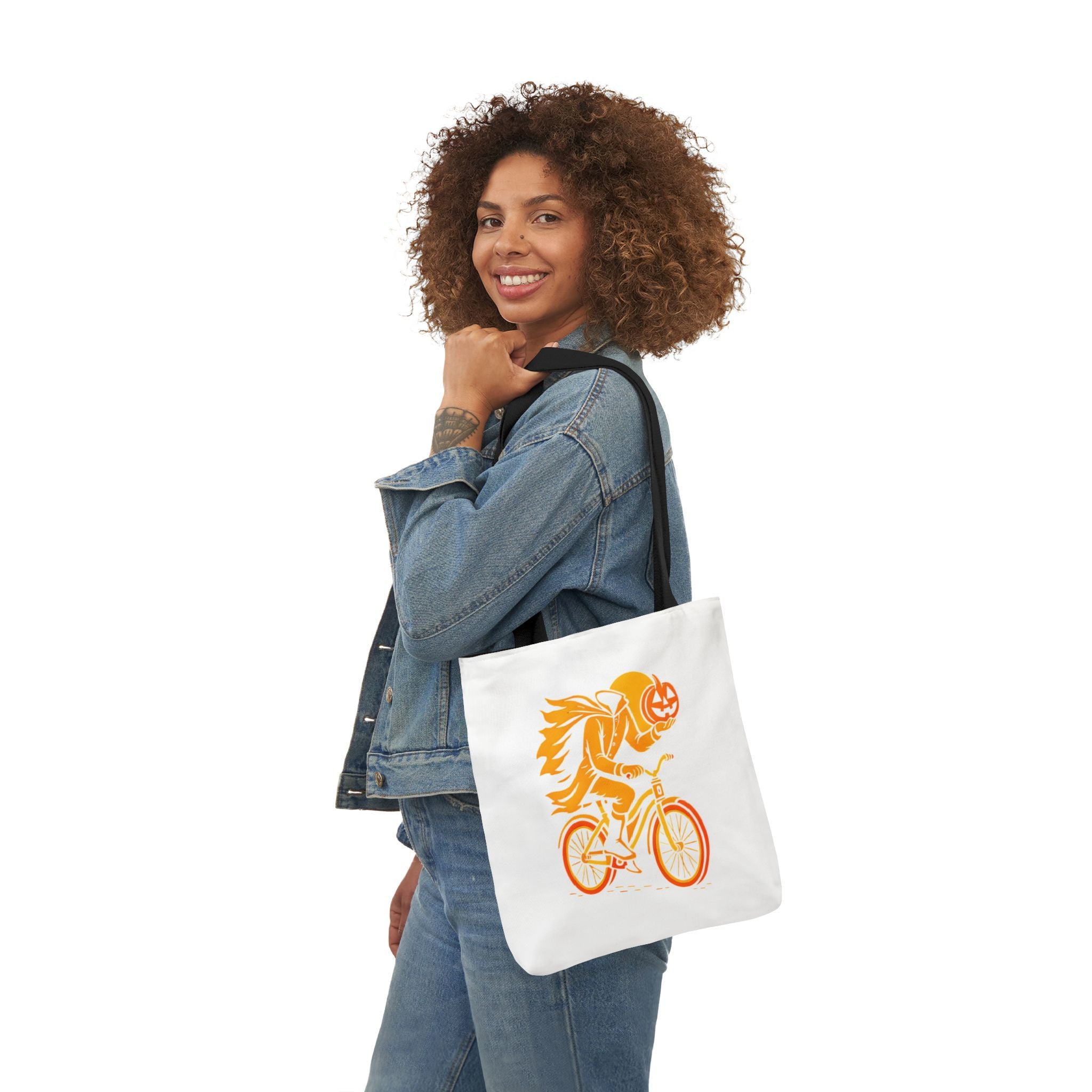 White canvas tote bag with black handles, orange ghost rider motorcycle Halloween design