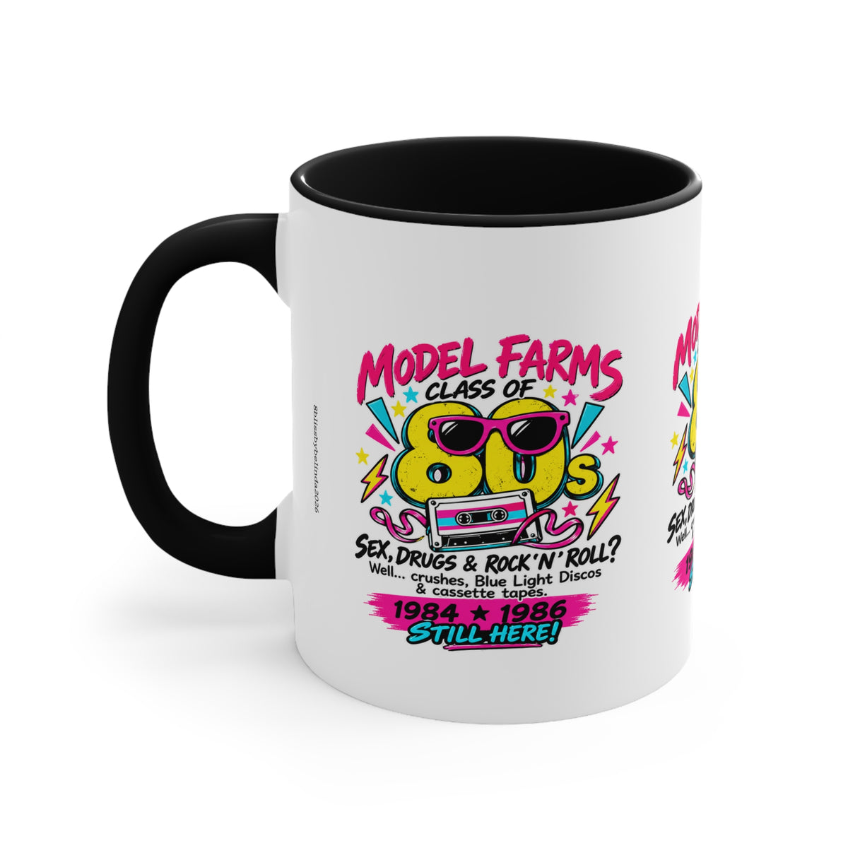White ceramic coffee mug with black interior and handle, retro cassette graphic
