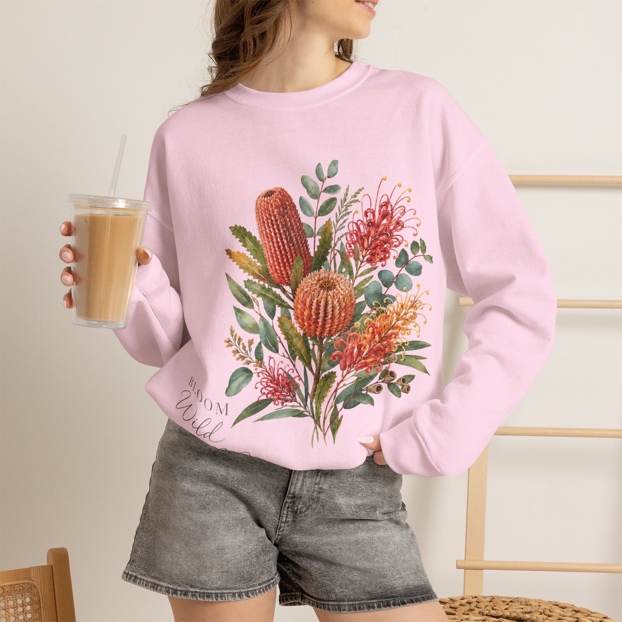 Light pink crewneck sweatshirt featuring colorful floral cactus graphic