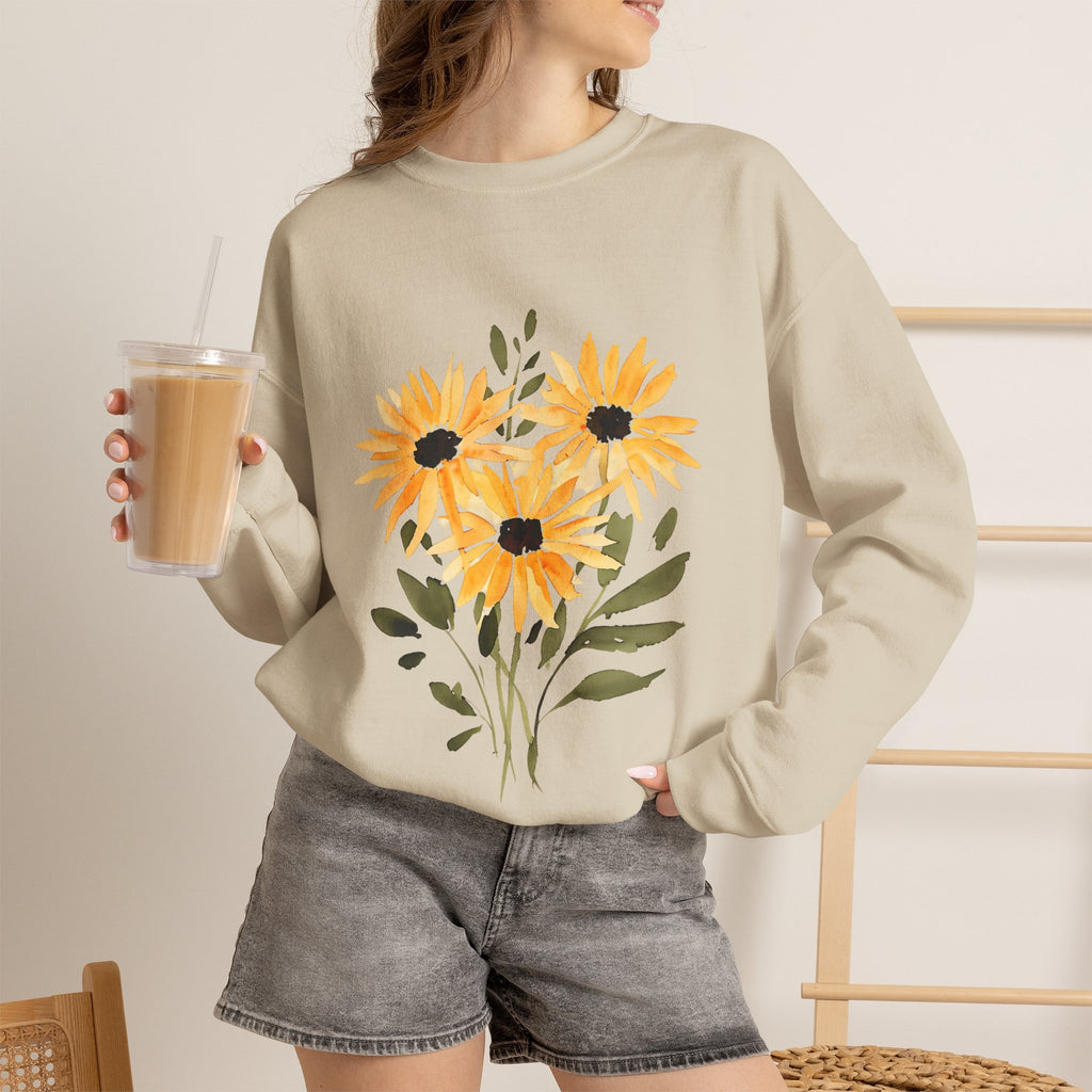 Beige crewneck sweatshirt worn by a model, featuring a sunflower bouquet front graphic