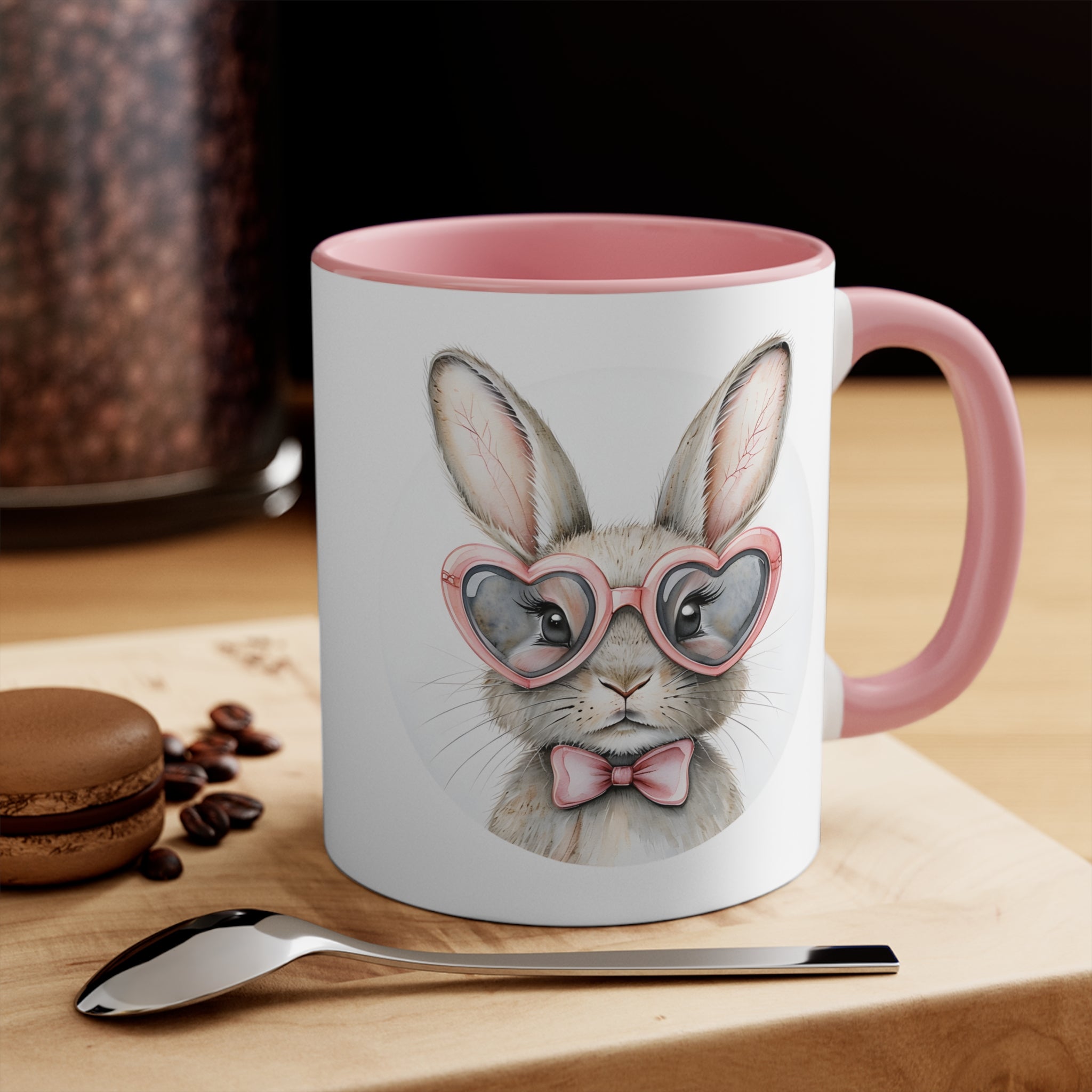 Pink-and-white ceramic bunny mug with bunny face wearing glasses and a bow