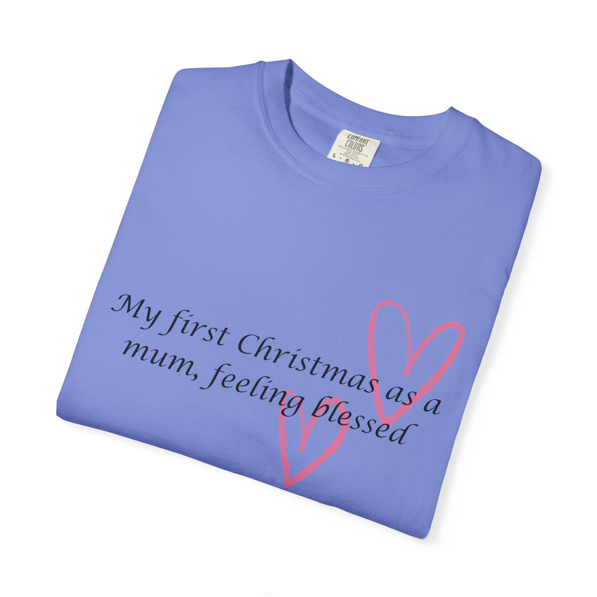 Folded blue Christmas mum t-shirt showing pink heart and “My first Christmas” text