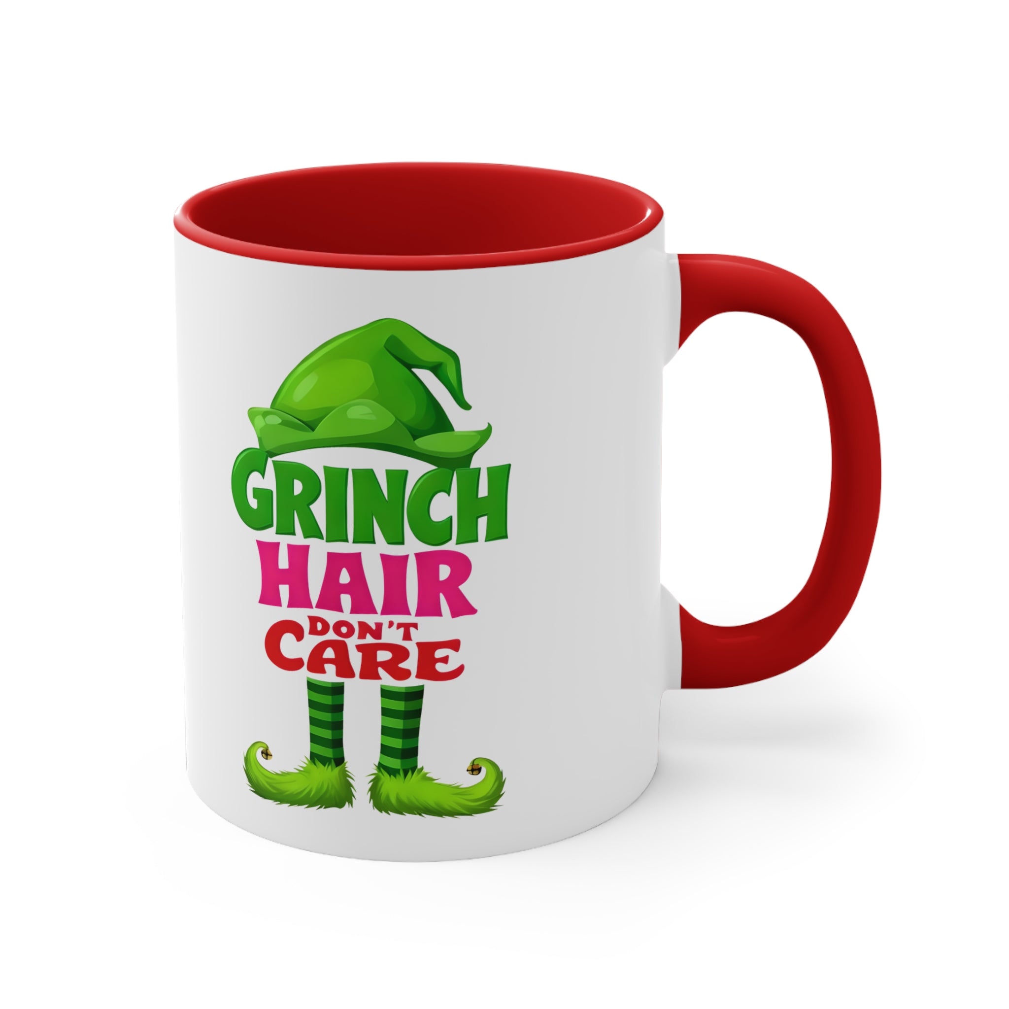 White ceramic mug with green Grinch Hair Don't Care graphic, red handle and rim.