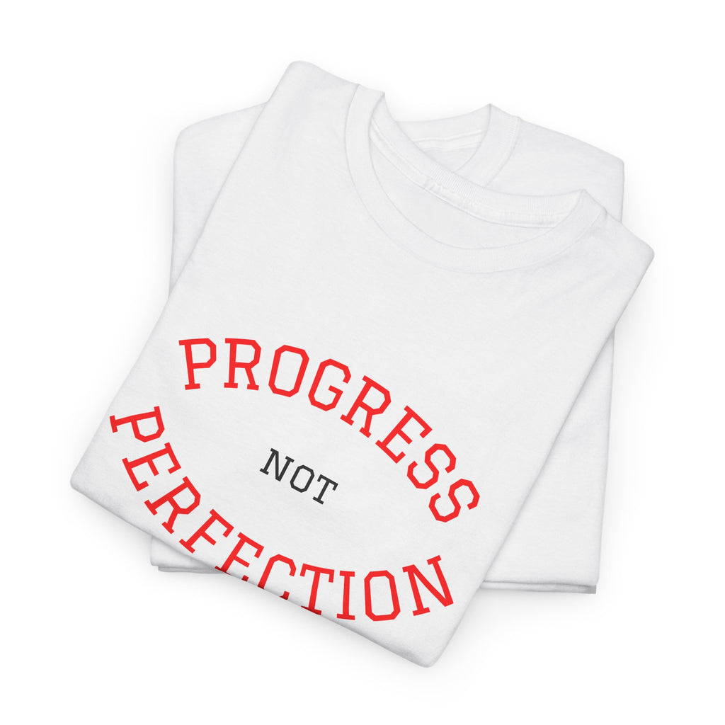 White unisex cotton tees stacked with red "PROGRESS NOT PERFECTION" slogan