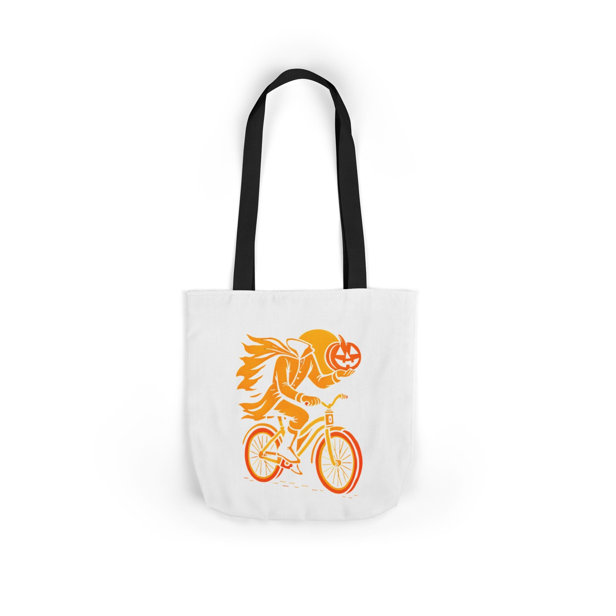 White canvas tote bag with black handles, orange ghost rider pumpkin graphic