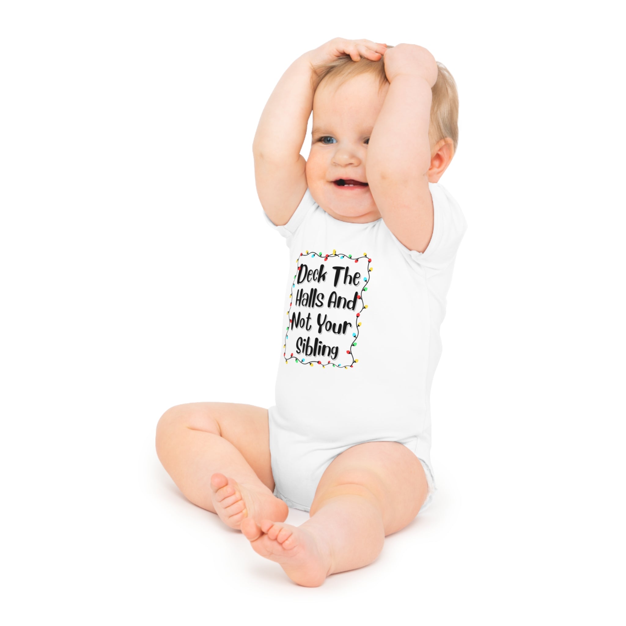 White baby onesie with holiday lights text graphic, short sleeves, worn by baby