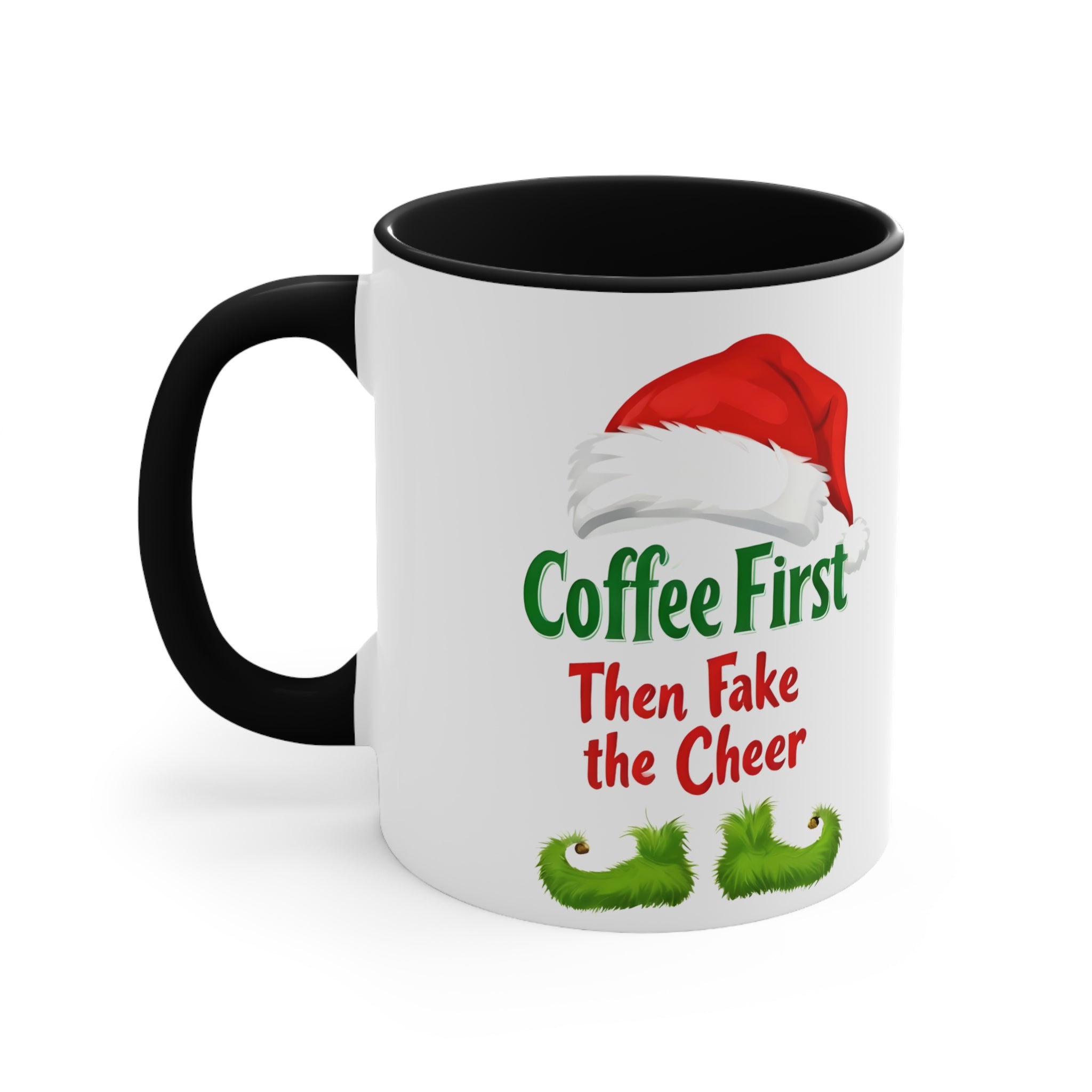 White ceramic Christmas mug with black rim/handle, Santa hat and “Coffee First Then Fake the Cheer”.