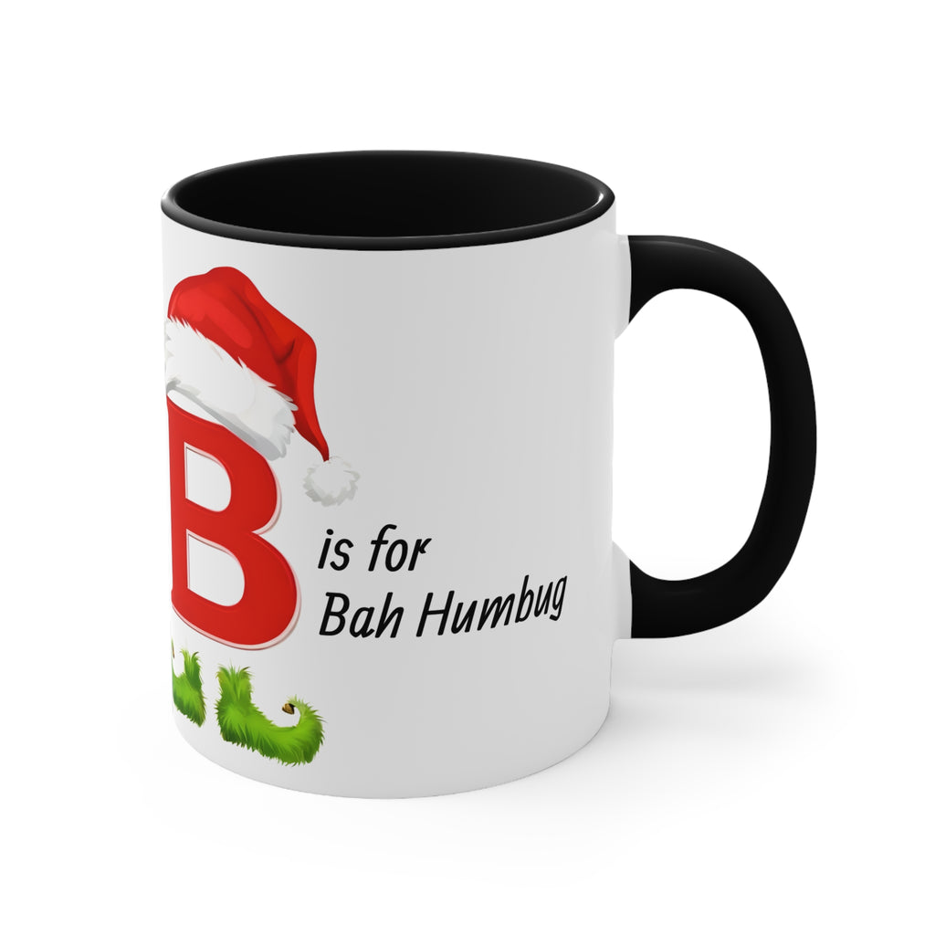 White mug with black handle, letter B and 'Bah Humbug' holiday text with holly