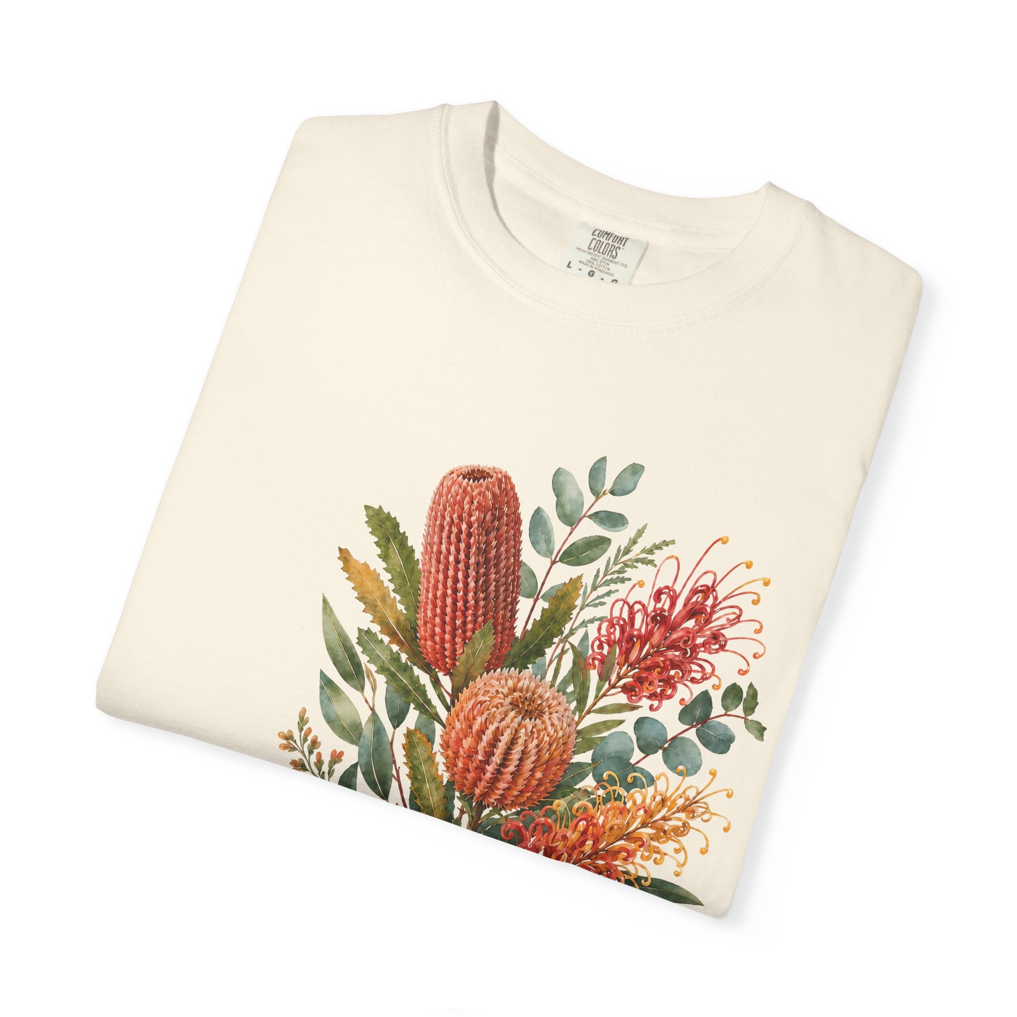 Ivory crew-neck t-shirt with colorful protea bouquet graphic print, close-up view